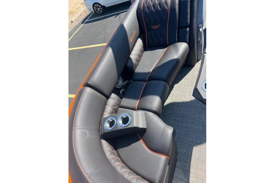 Luxurious seating on 2024 Bennington 23 RXFBA boat with cup holders and stylish design.