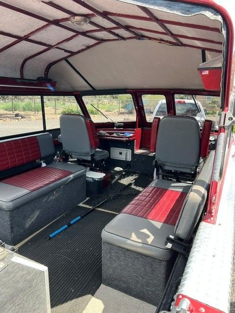Interior of a 1996 Northwest Signature boat with red seating.