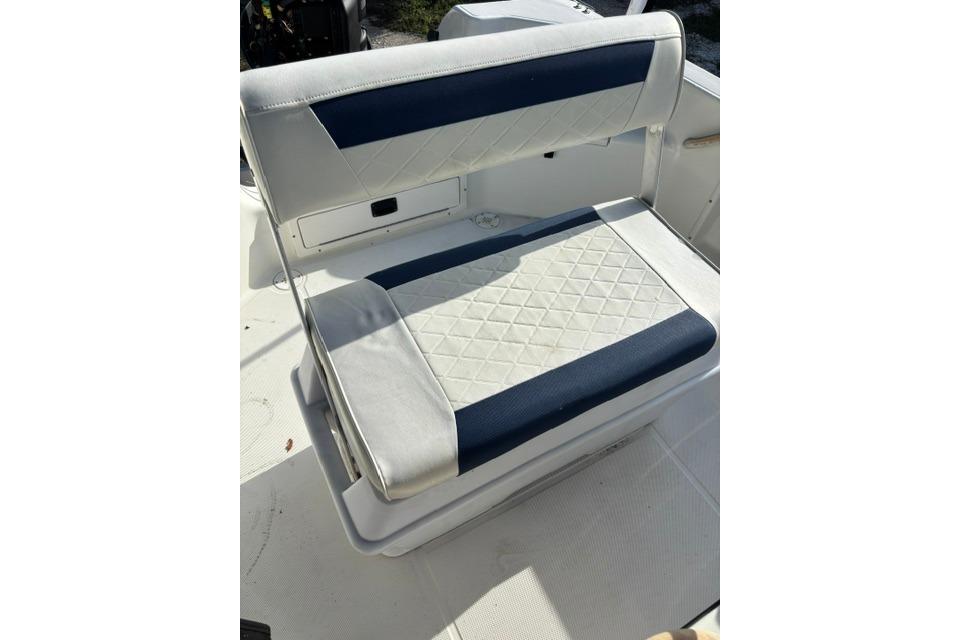 2005 Hydra-Sports Lightning 180 CC boat seat with white and blue upholstery.