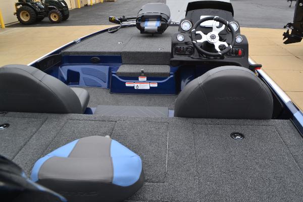 Interior view of a 2025 Nitro Z17 boat, featuring seating and steering console.