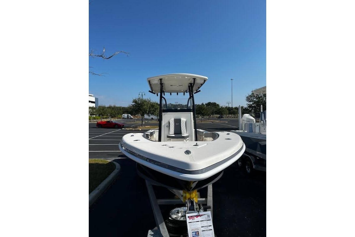2026 Ranger 2600 Bay boat displayed outdoors under clear blue sky.