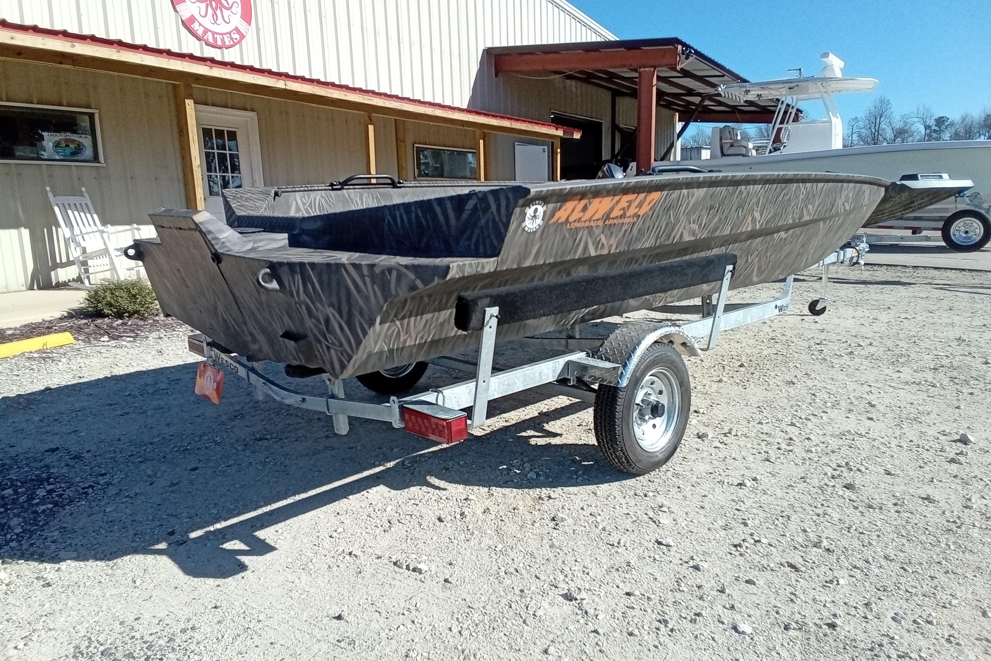 2026 Alweld 1756 Invader boat on trailer outside a building, sunny day.