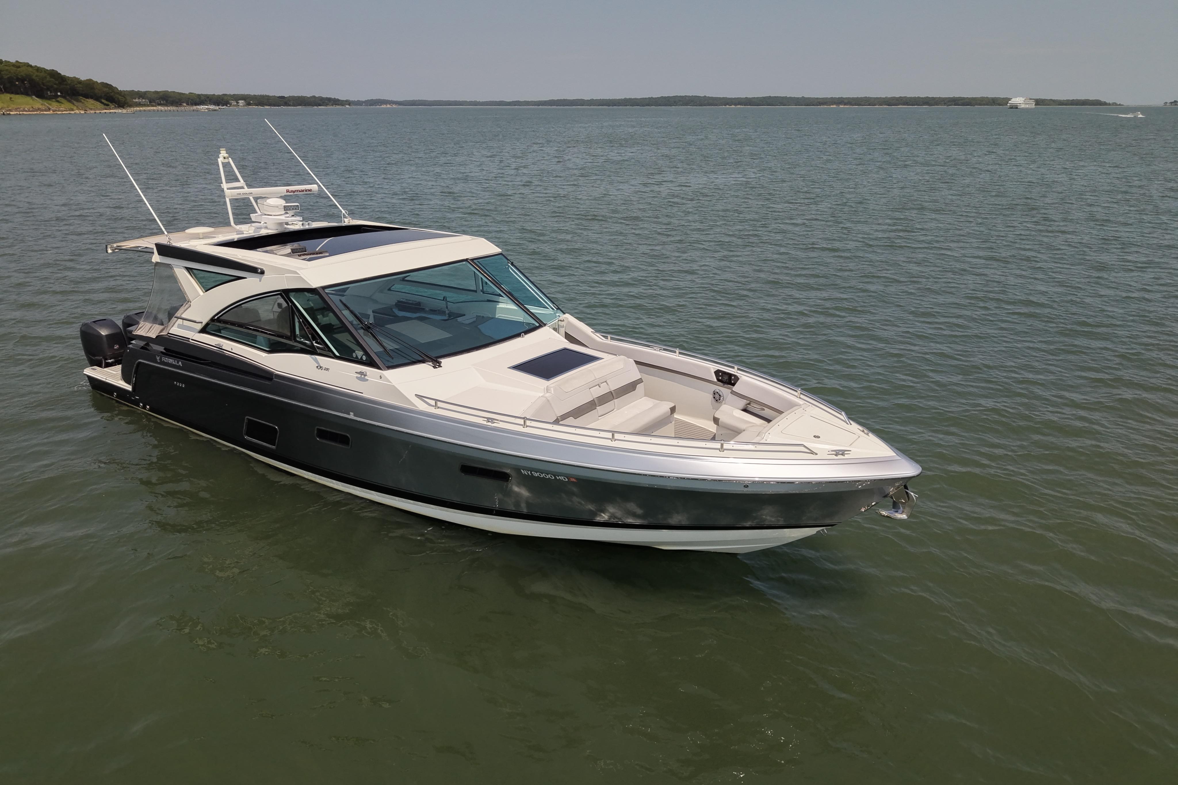 2019 Formula 430 Super Sport Crossover boat on calm water.