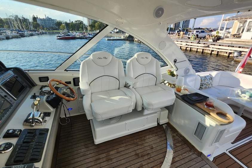 Interior of 2007 Sea Ray 480 Sundancer yacht with luxurious seating and helm.