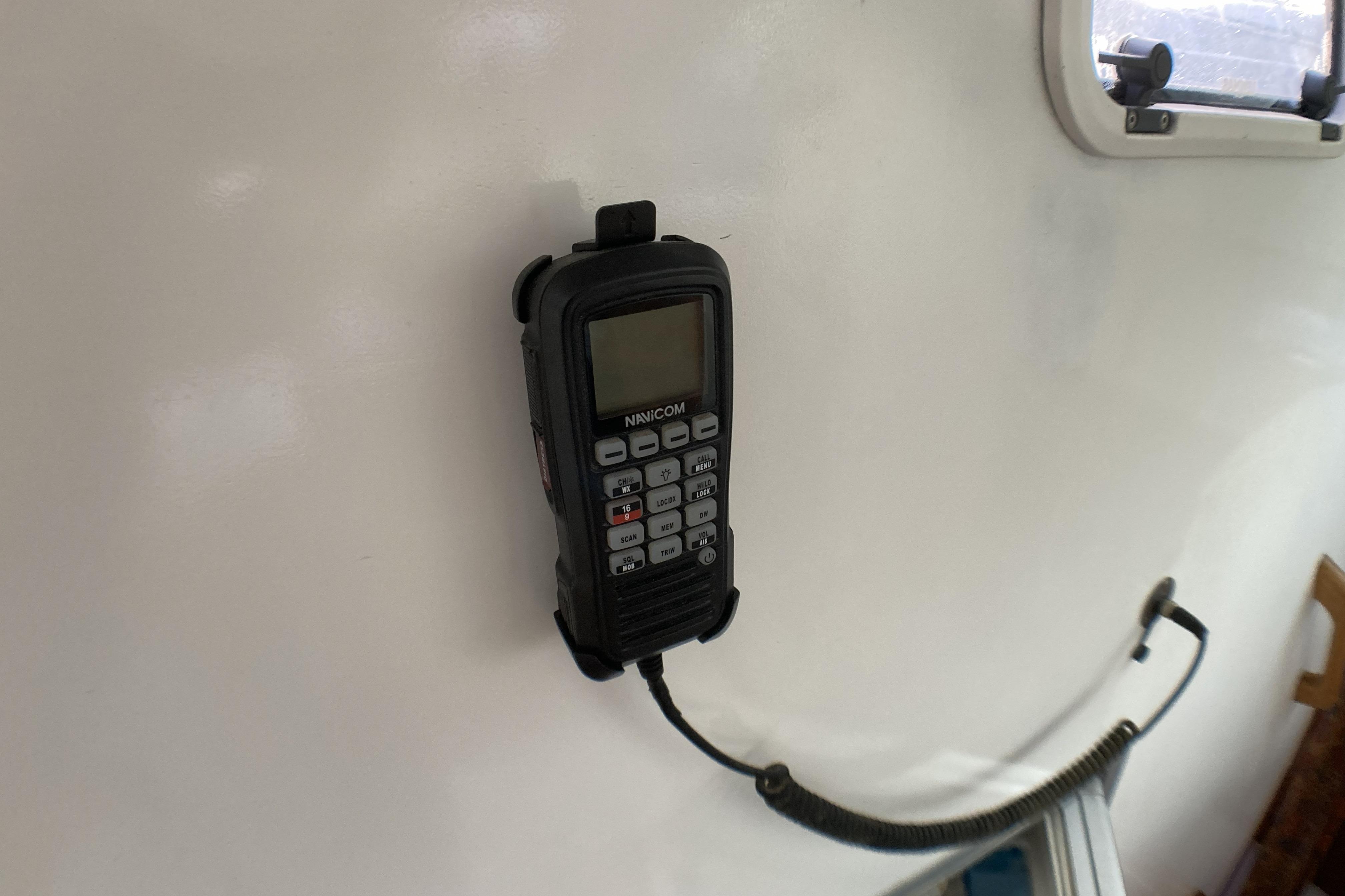 Marine radio mounted on a Naval Force 3 Piana 30, 1998 model boat interior.