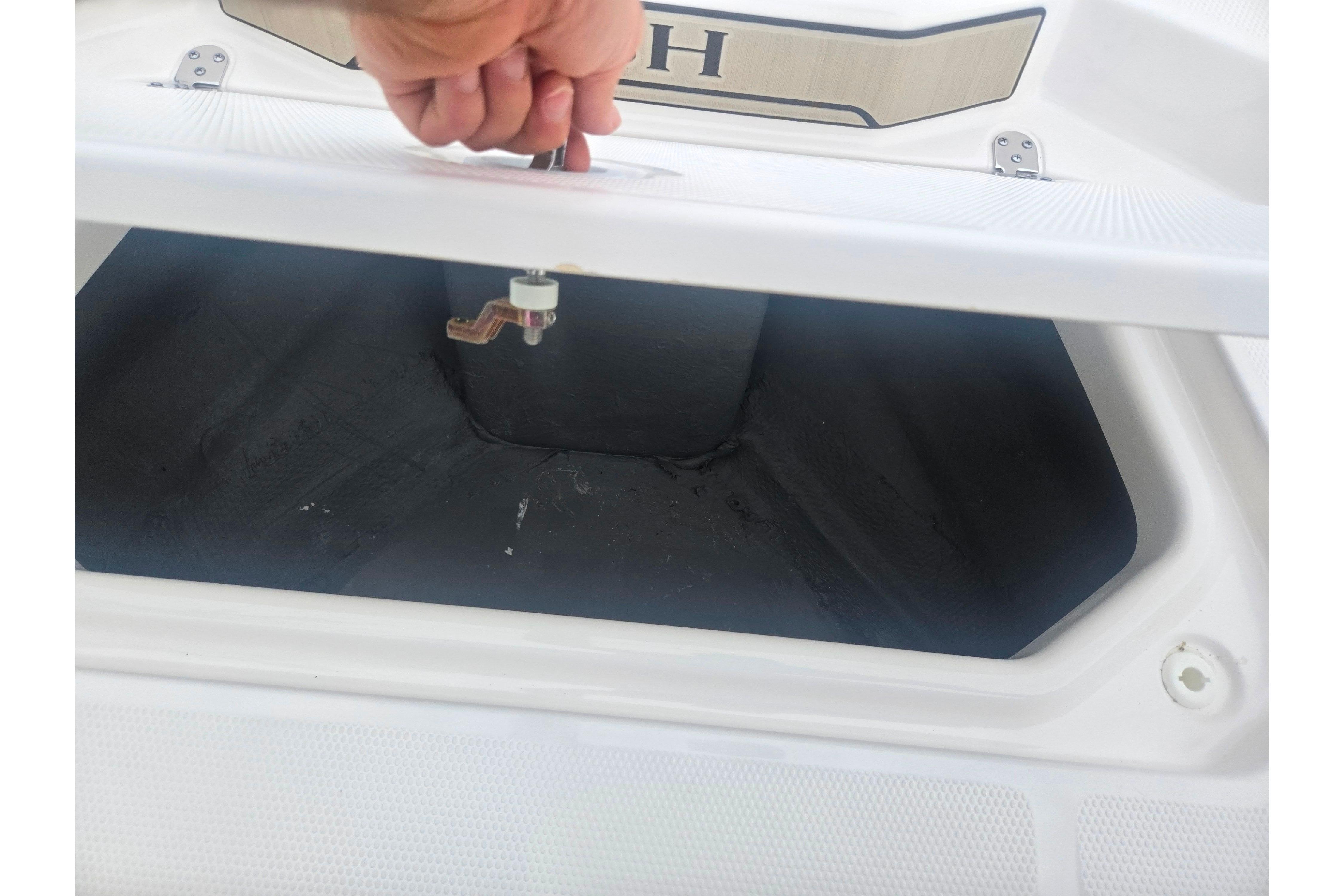 Open storage compartment on 2022 Yamaha Boats 195 FSH Sport.