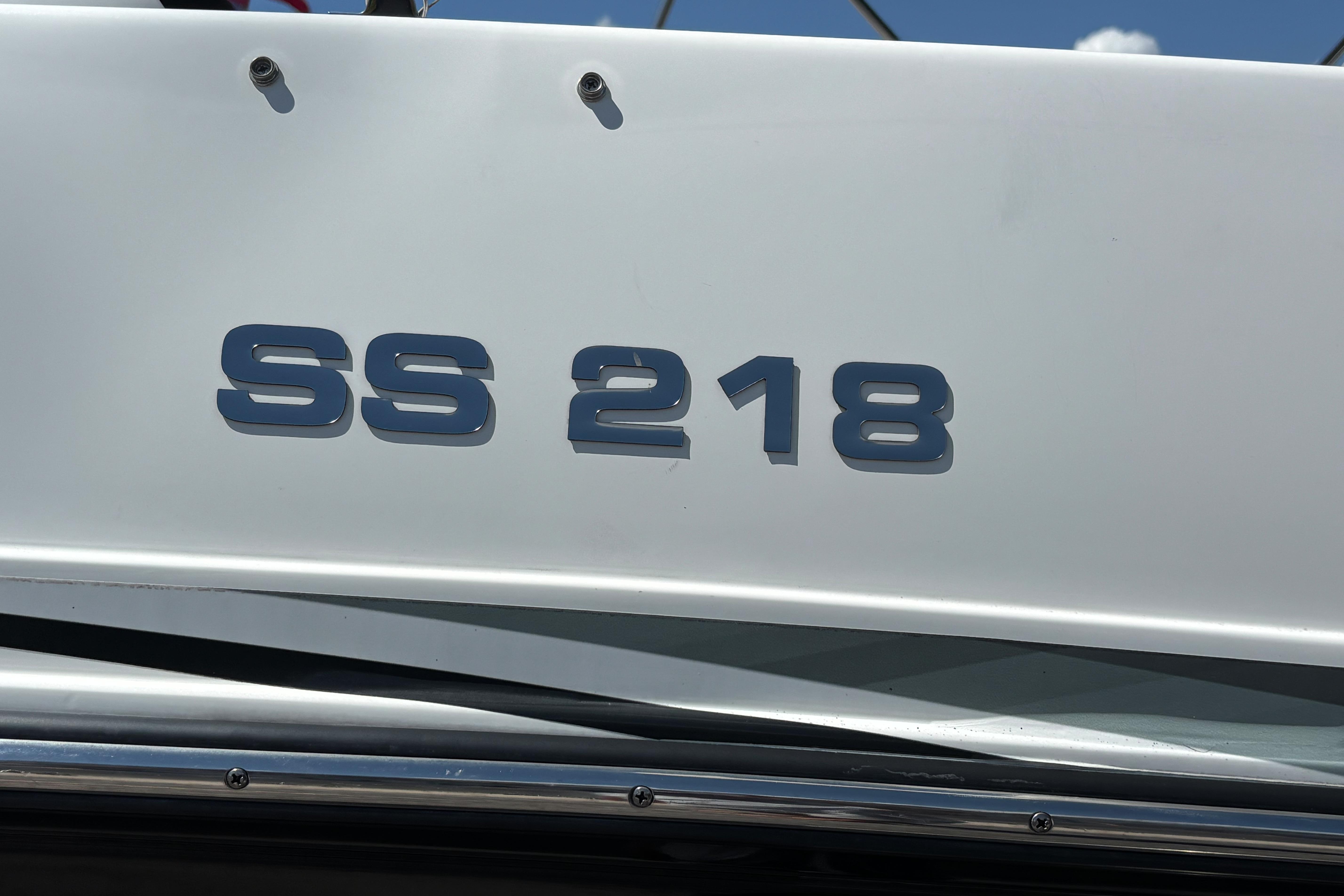 2019 Hurricane Sundeck Sport 218 OB boat with "SS 218" lettering on the side.