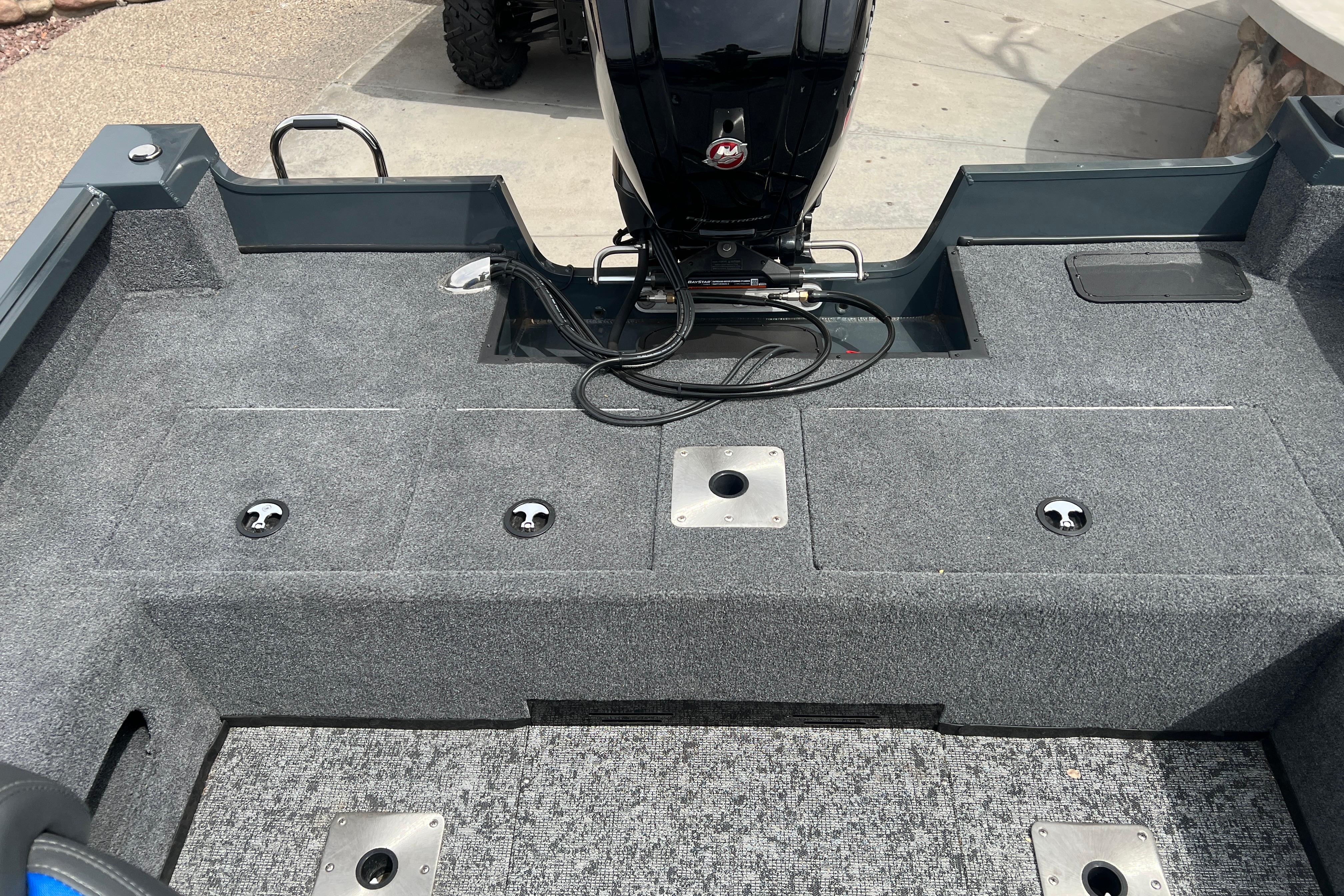 2026 Ranger VS1682SC Angler boat interior with carpeted deck and motor.