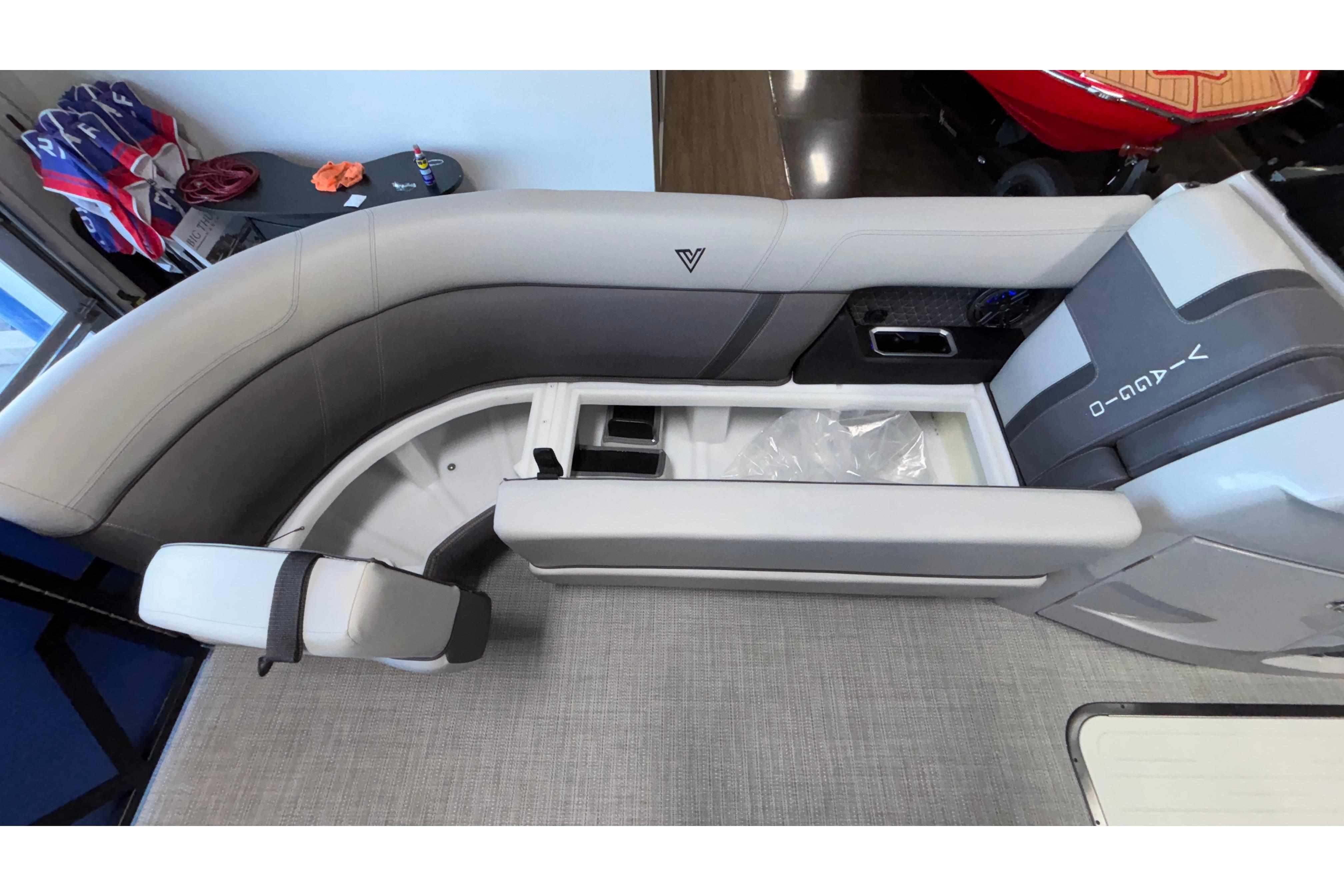 2026 Viaggio Z24U boat interior with gray seating and storage compartment.