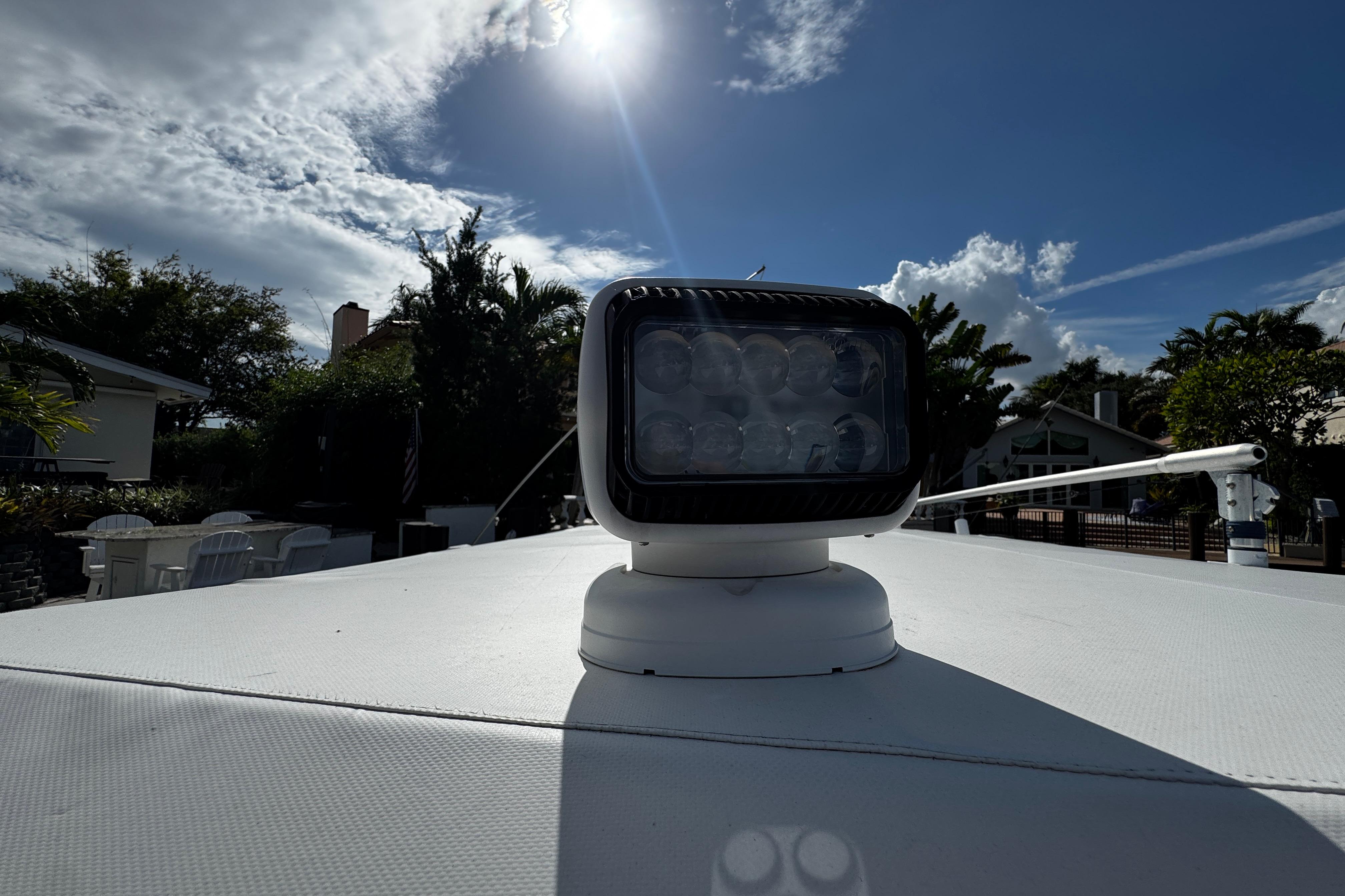 2004 Dusky 33 boat spotlight under a bright sunlit sky.