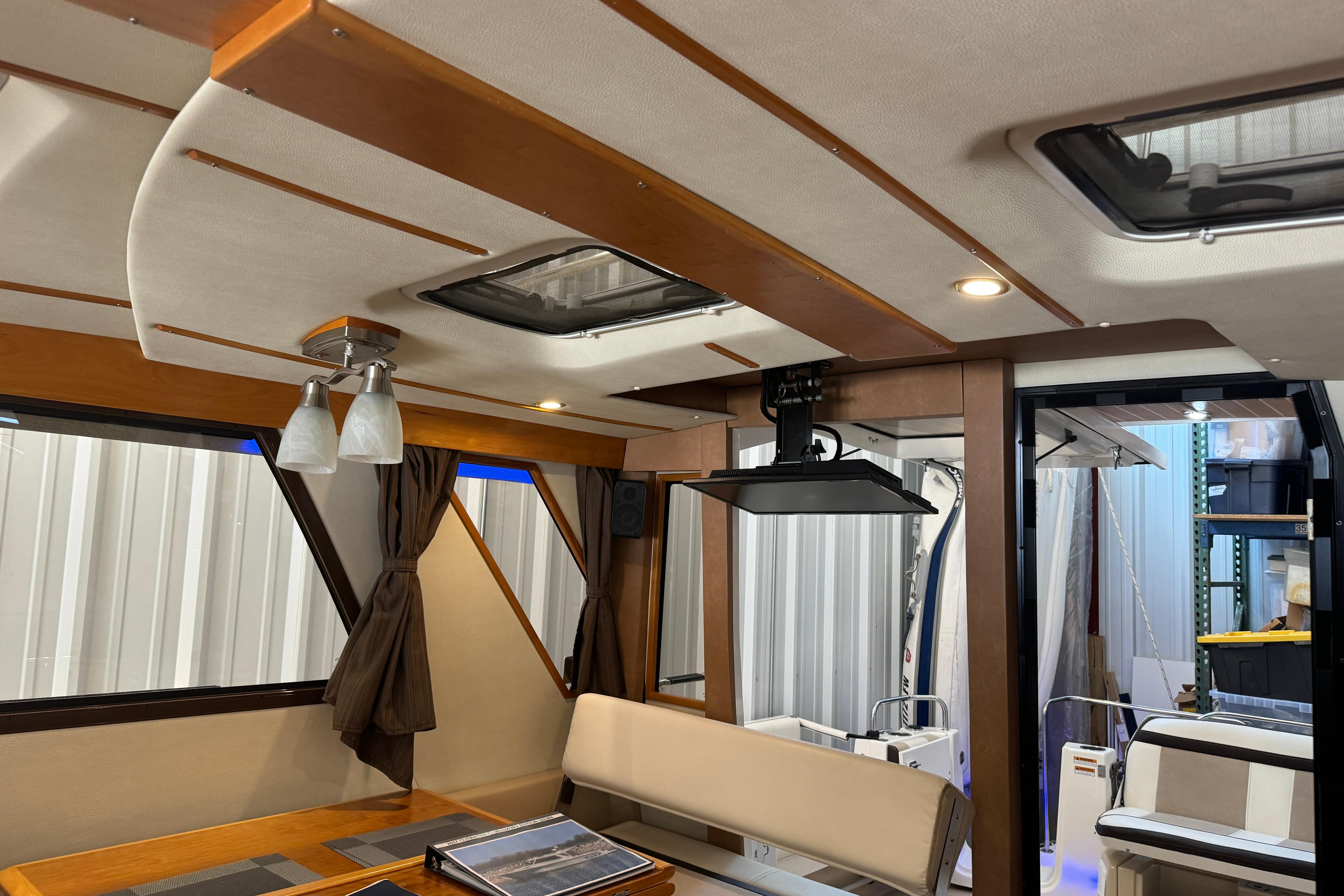 Interior of a 2017 Cutwater C-30 Sedan boat with modern furnishings and lighting.