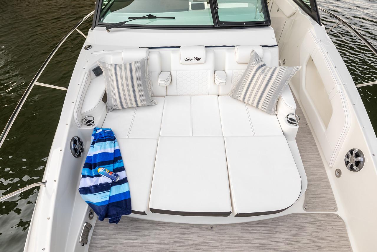 Manufacturer Provided Image: 2022 Sea Ray Sundancer 320 boat with spacious sun deck and striped pillows.