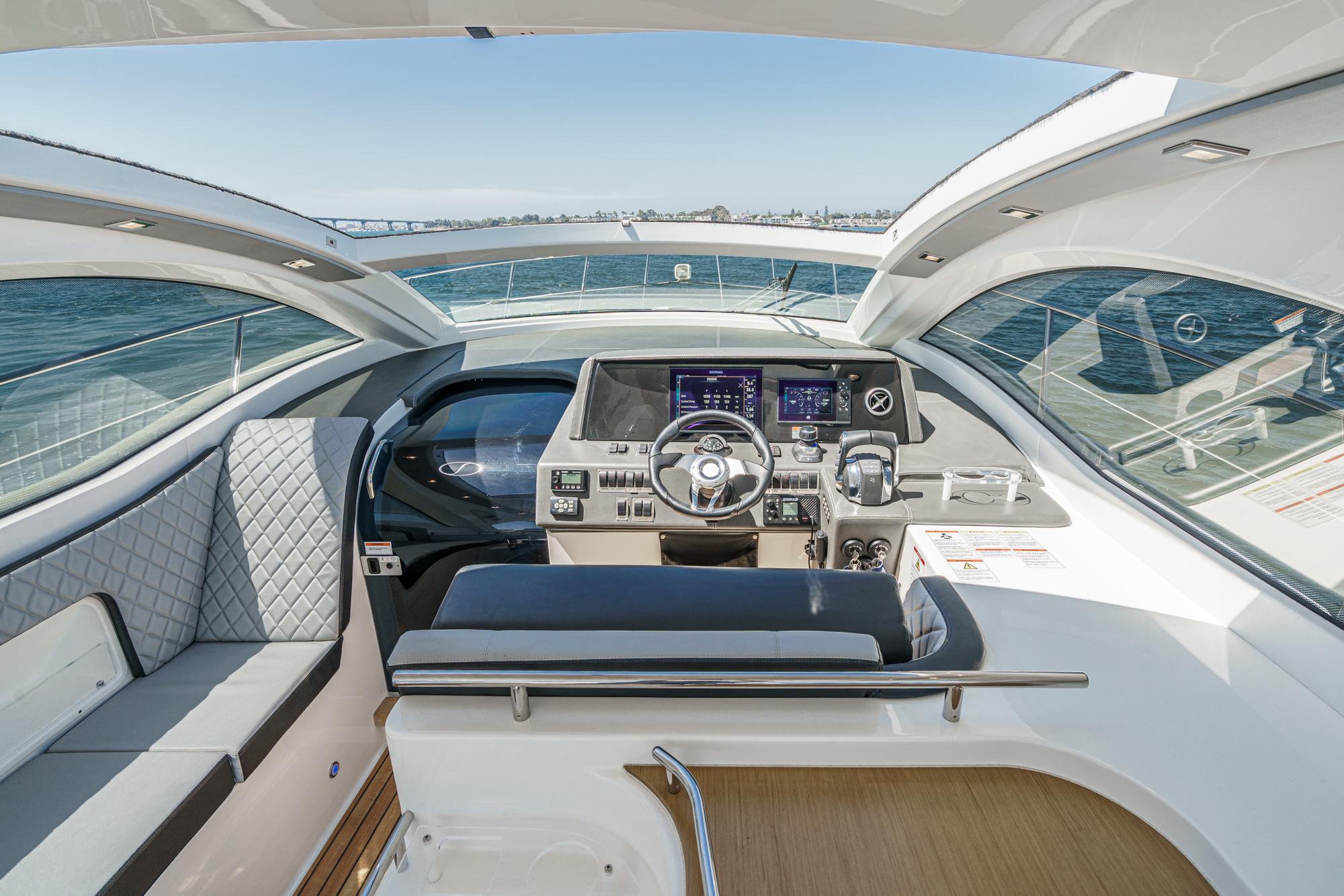 Cockpit of 2021 Schaefer 400 yacht with modern controls and panoramic view.