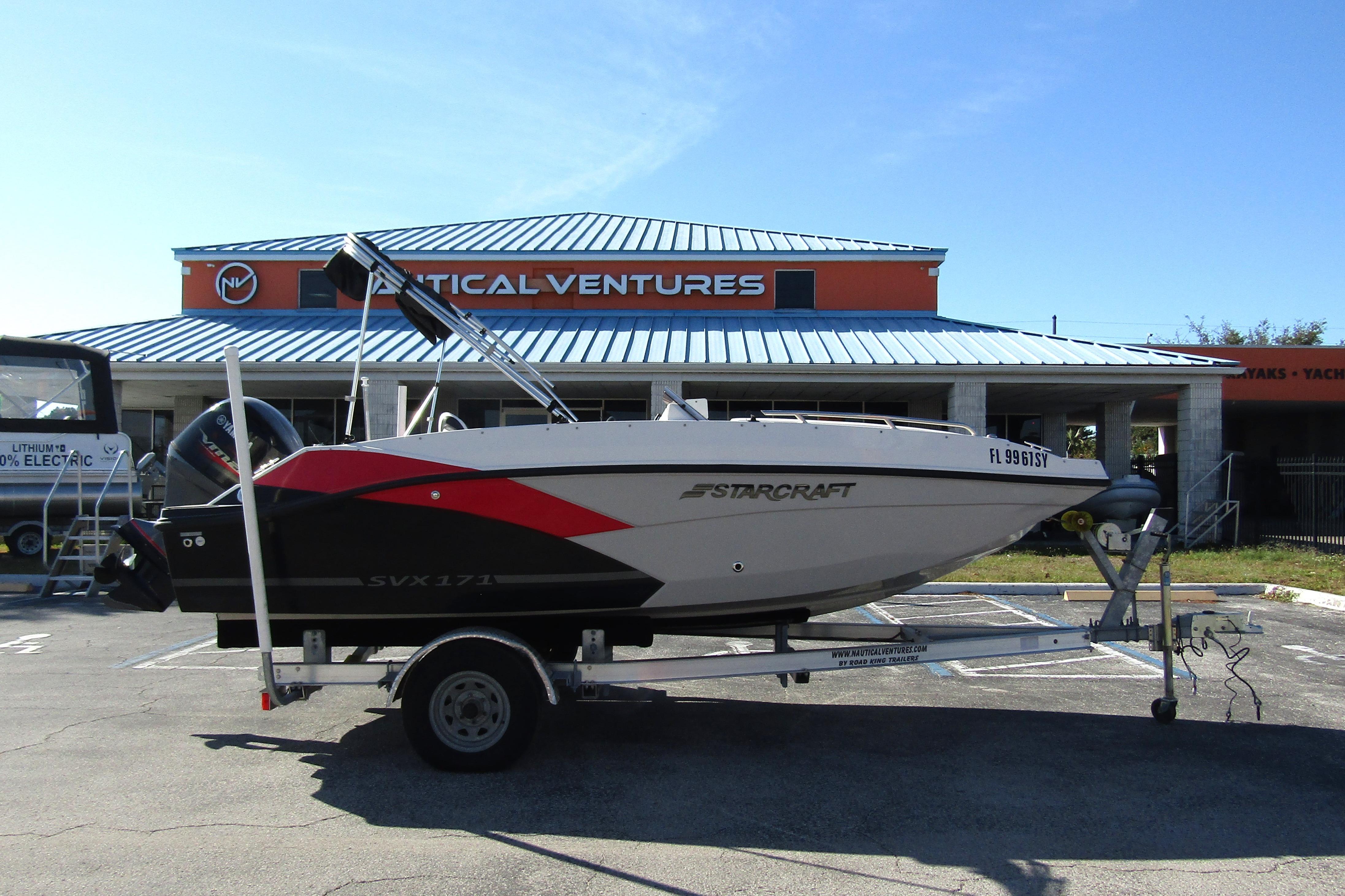 2021 Starcraft SVX 171 OB boat on trailer outside Nautical Ventures store.