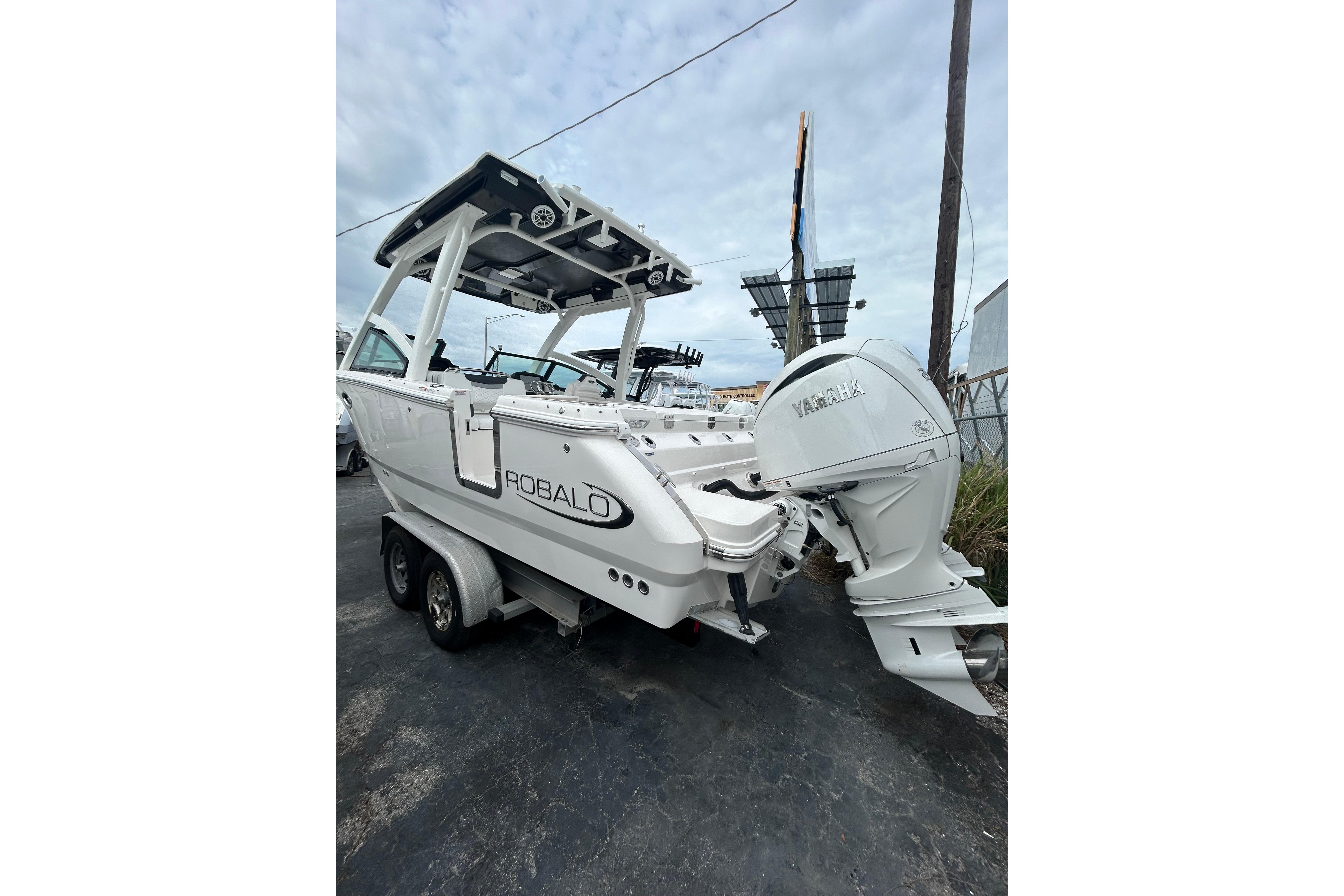 2026 Robalo R257 Dual Console boat with Yamaha outboard engine on trailer.