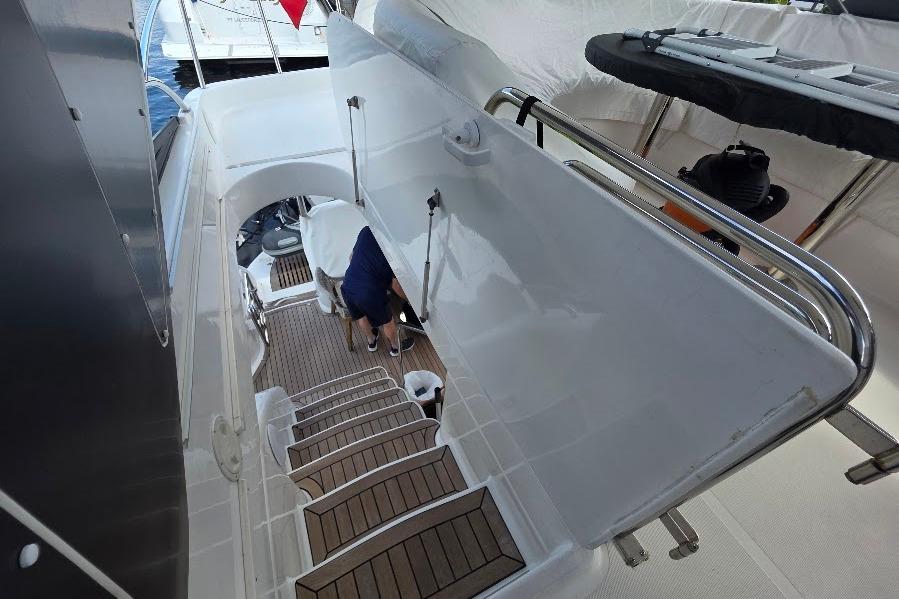 Staircase on 2008 Neptunus Flybridge MY yacht, featuring sleek design and wooden steps.