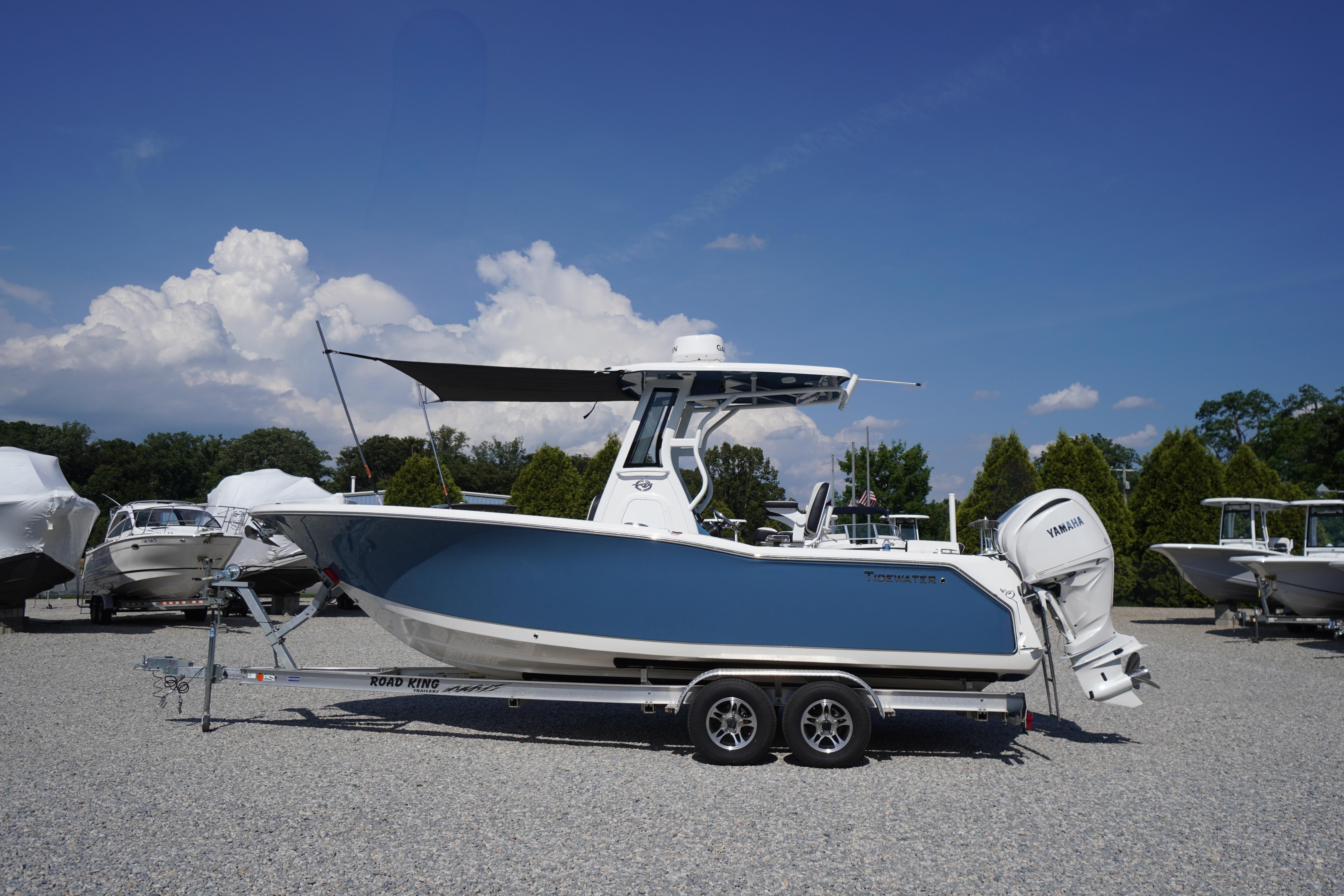 2025 Tidewater 232 SS boat on trailer under clear blue sky.
