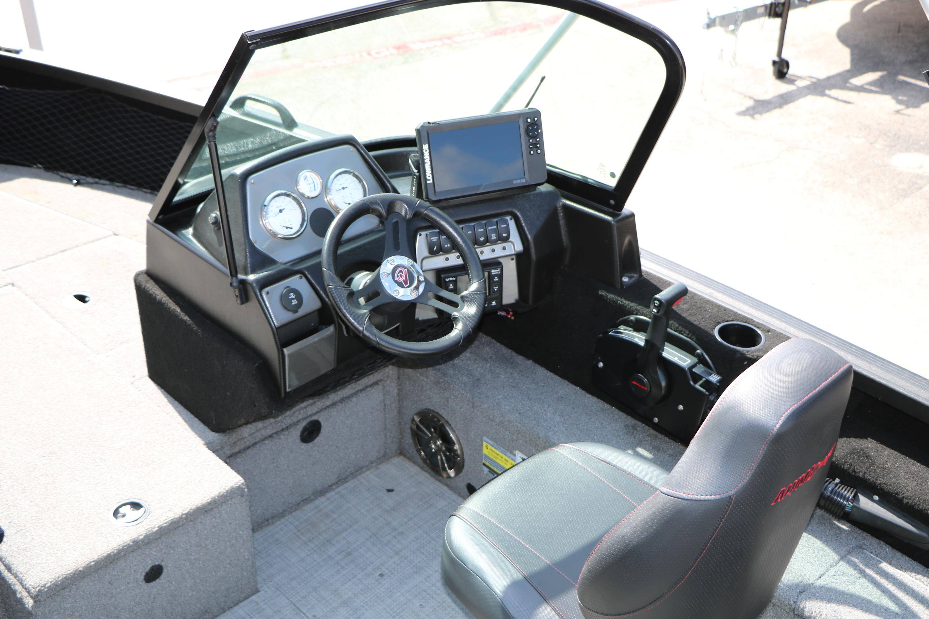 2023 Alumacraft Competitor FSX 185 boat cockpit with steering wheel and control panel.