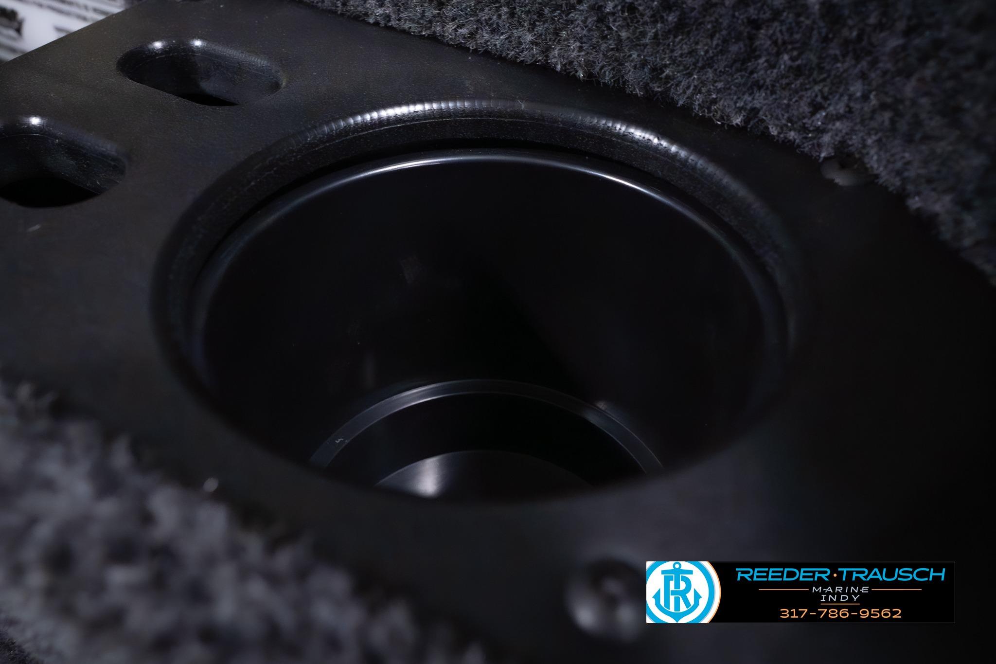 Cup holder detail in 2026 Lund 1875 Impact XS SS boat interior.