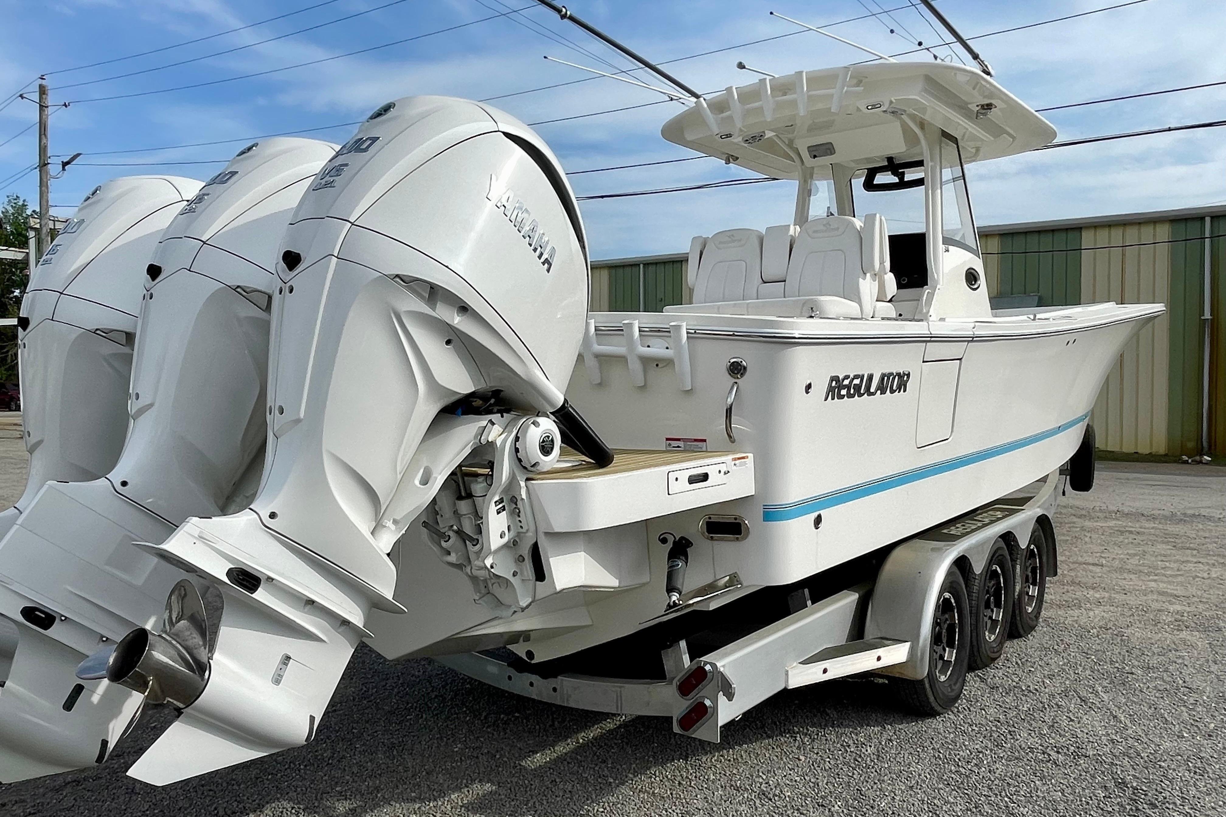 2023 Regulator 34 boat with triple Yamaha engines on a trailer.