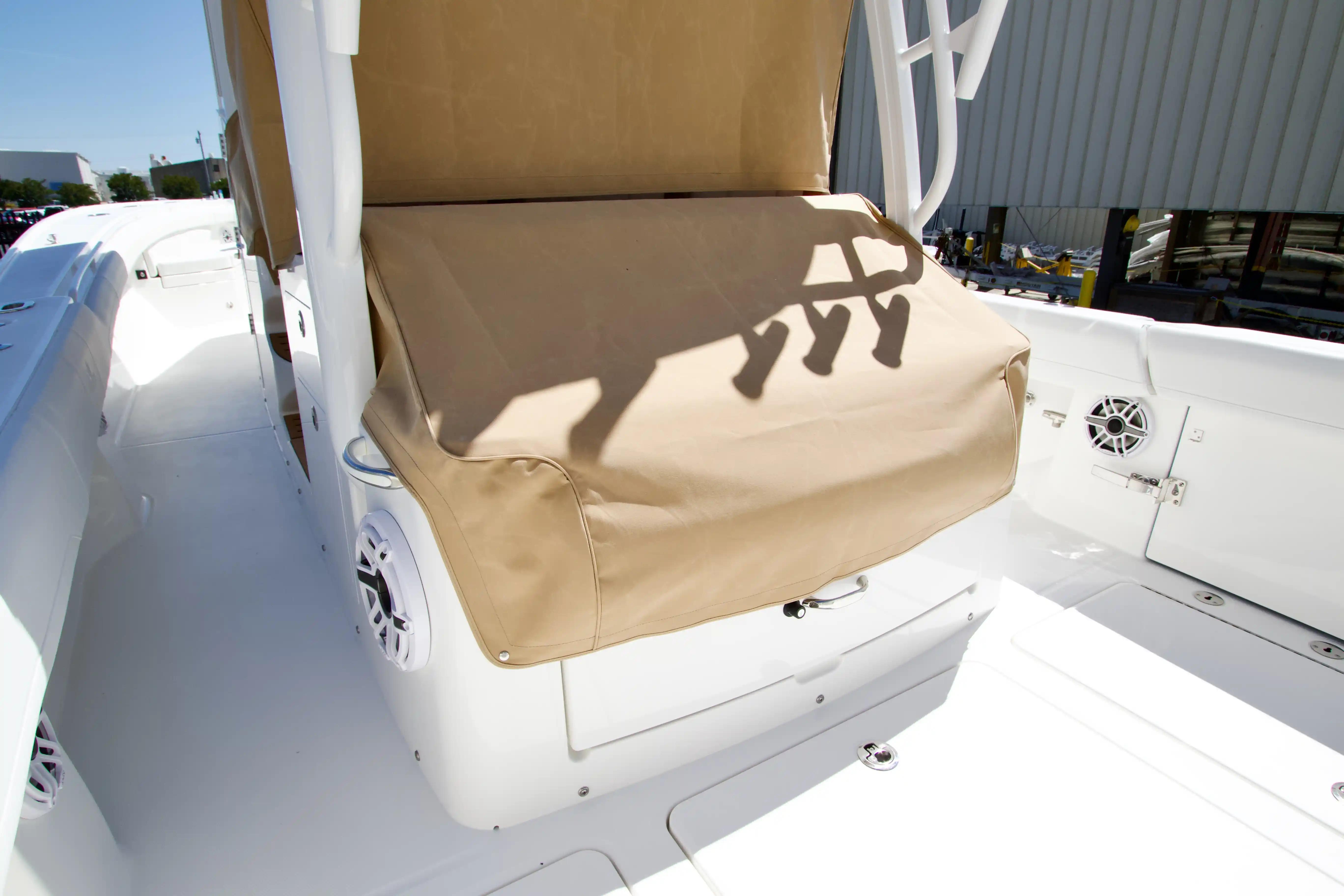 2027 Regulator 35 boat interior with beige seat cover and white speakers.