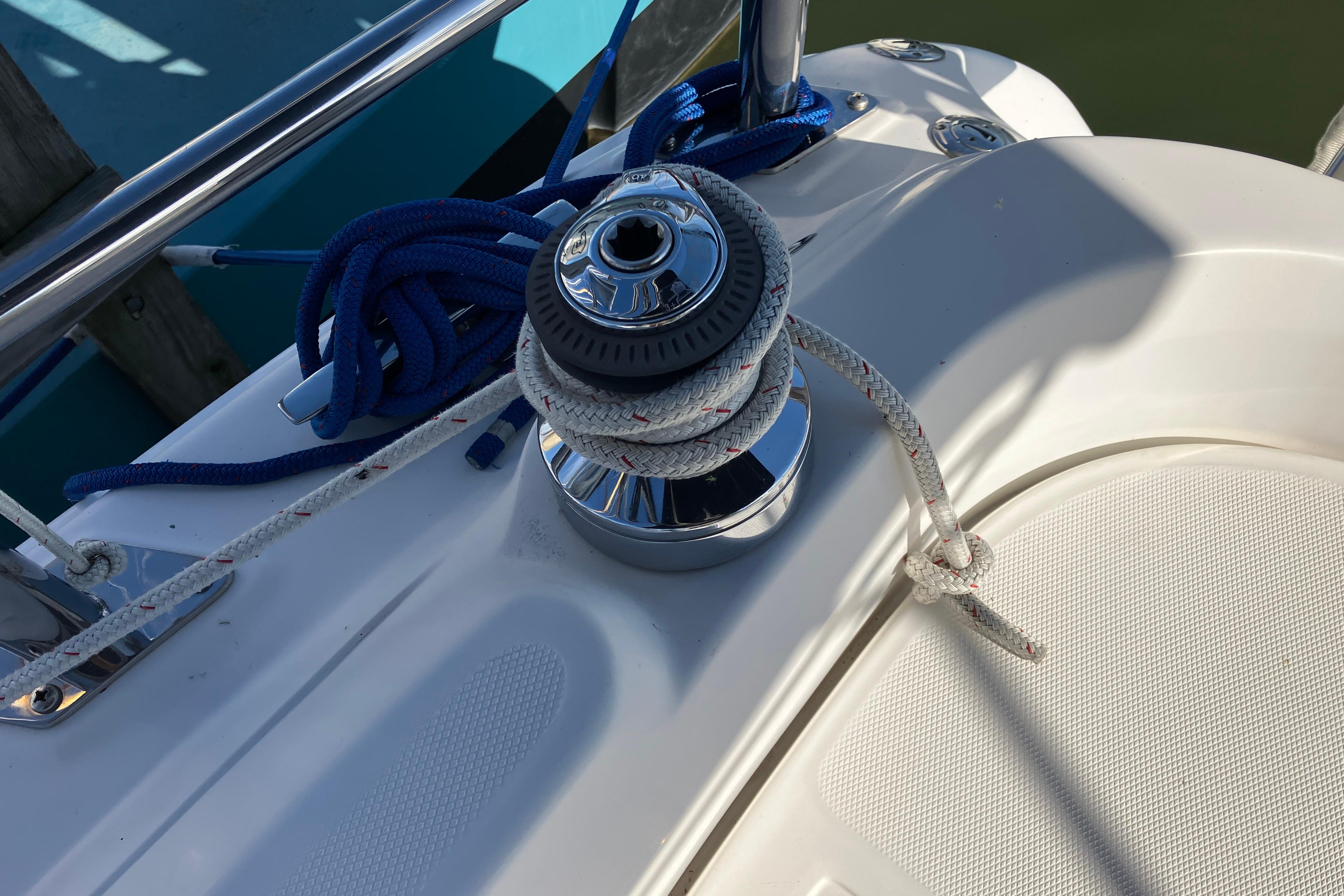 Winch and ropes on a 2005 Hunter 36 sailboat deck.