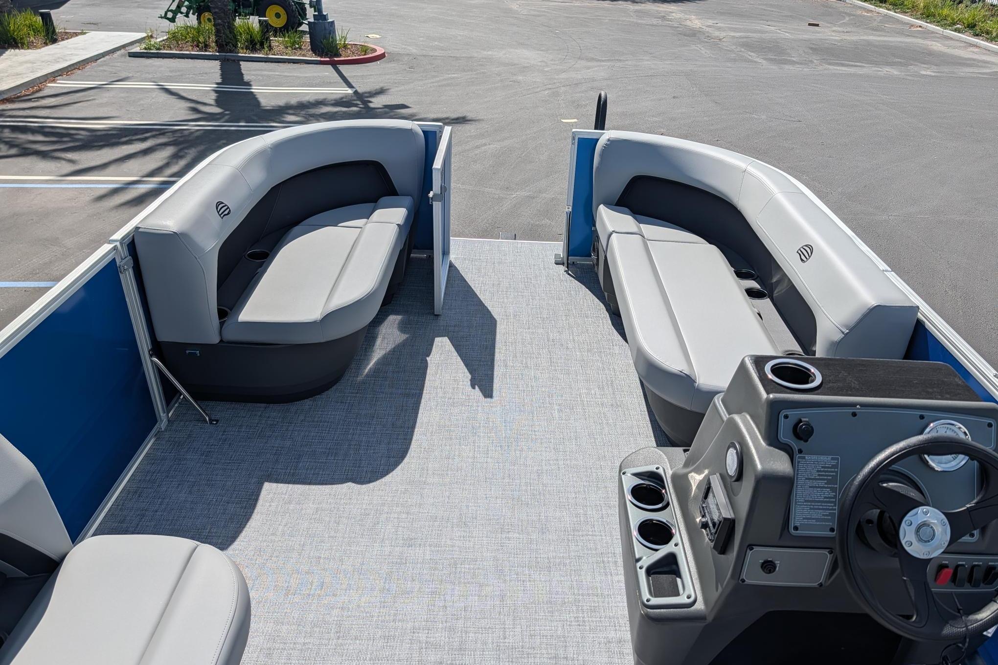 2026 Sun Tracker Party Barge 16 DLX pontoon boat interior with seating and helm.