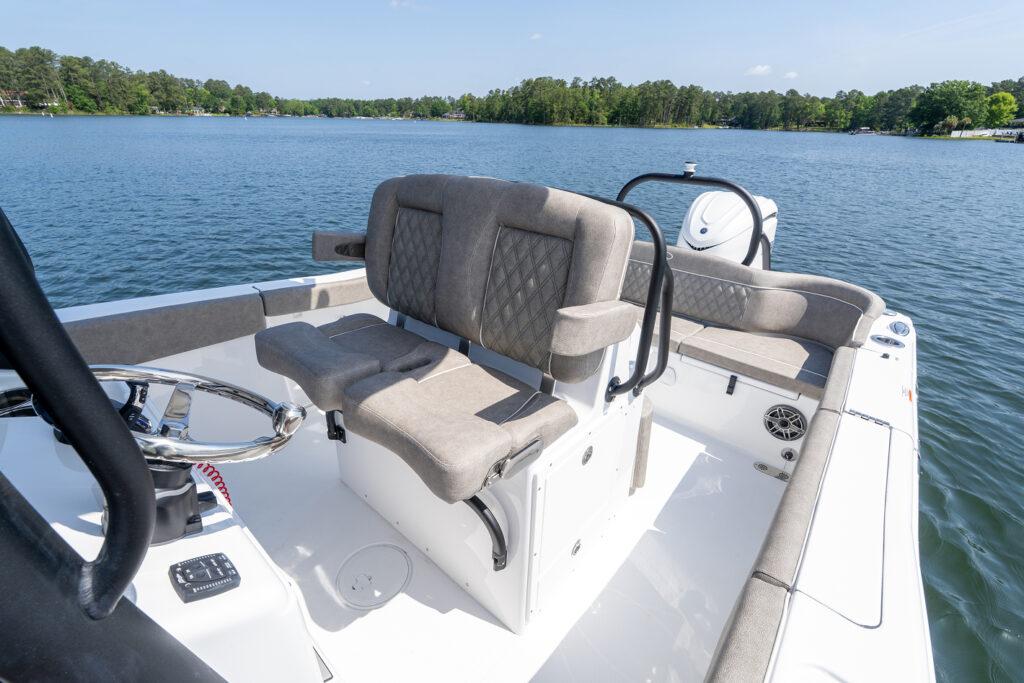 Manufacturer Provided Image: 2026 Sea Hunt Ultra 255 SE boat interior with cushioned seating on a calm lake.