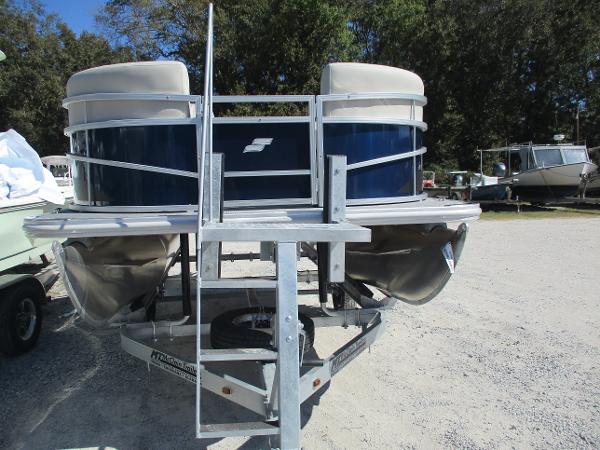 2025 Starcraft LX16R pontoon boat on trailer, parked outdoors.
