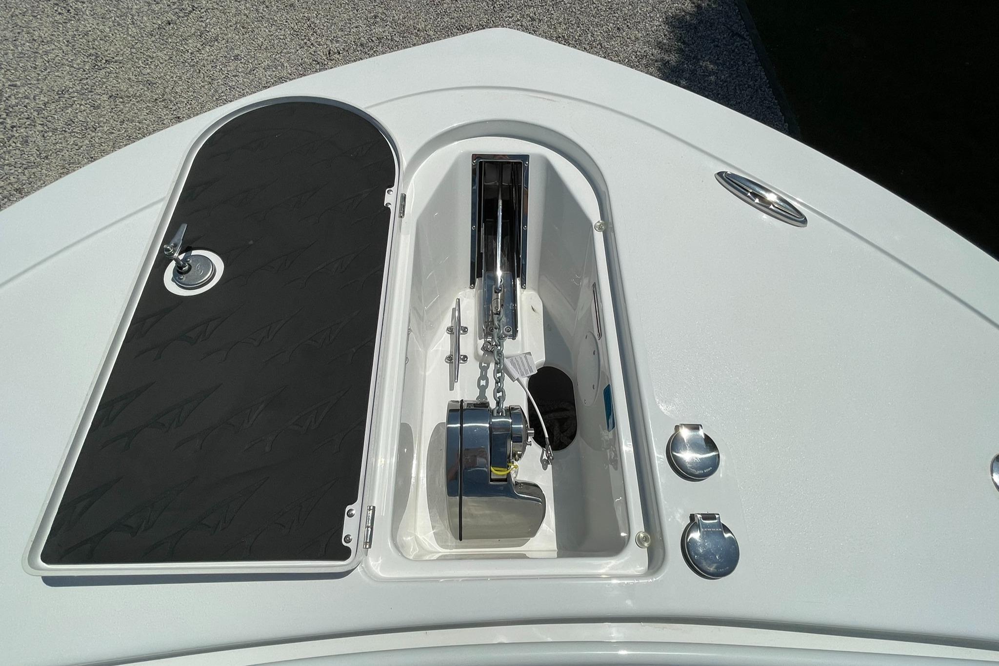 2026 Tidewater 302 CC Adventure boat anchor compartment with chain and storage.