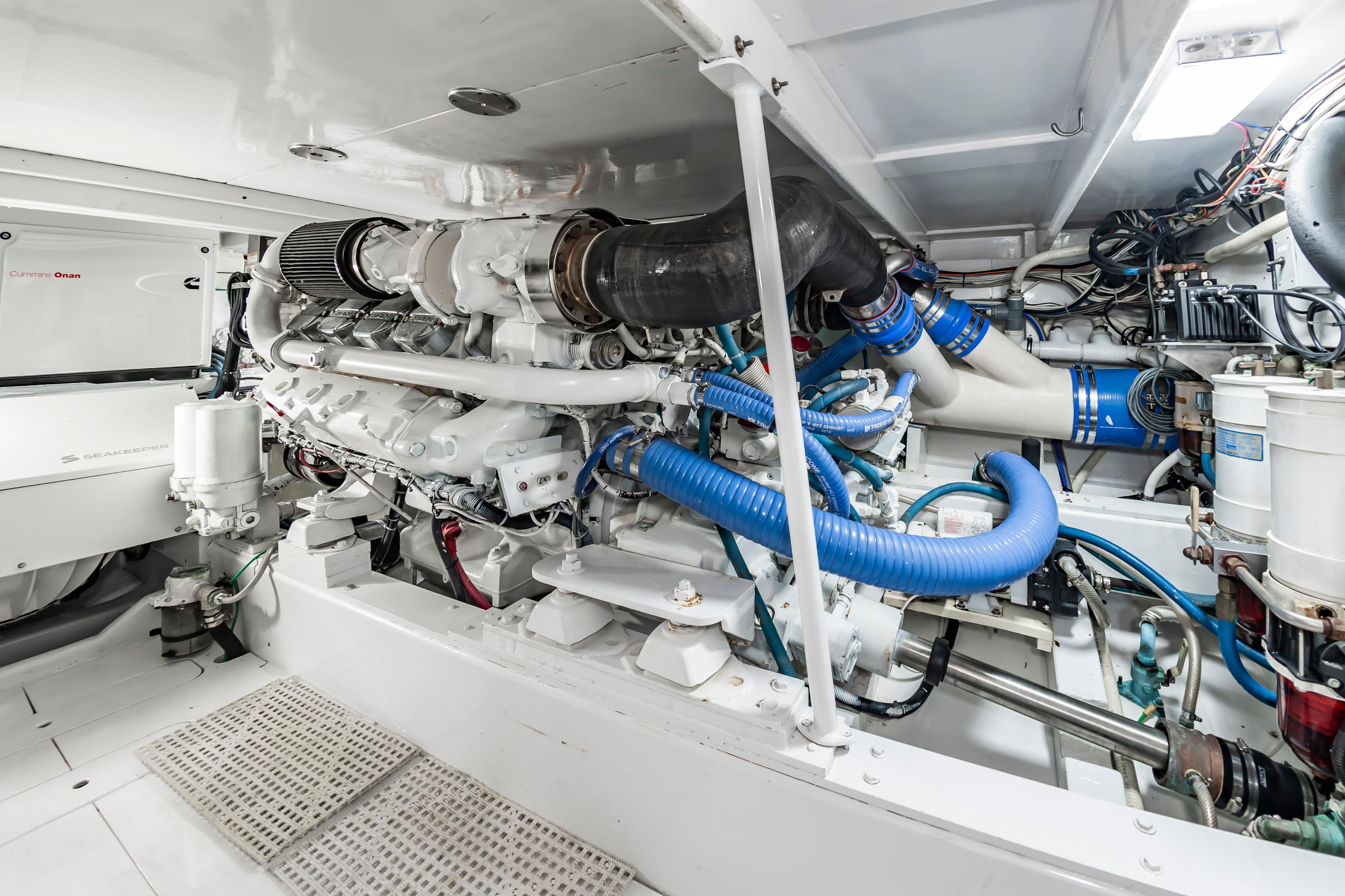 Engine room of 1993 Custom Carolina Scarborough 56 Convertible, showcasing detailed machinery and components.
