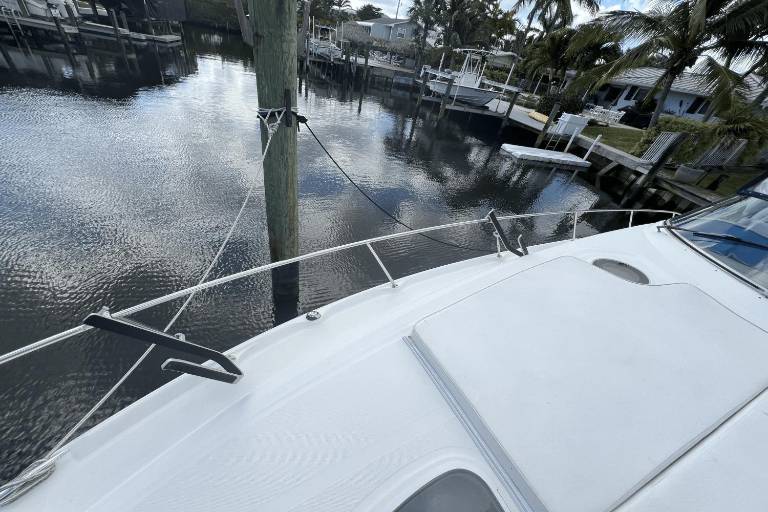 2005 Sea Ray 340 Sundancer docked in a serene marina setting.