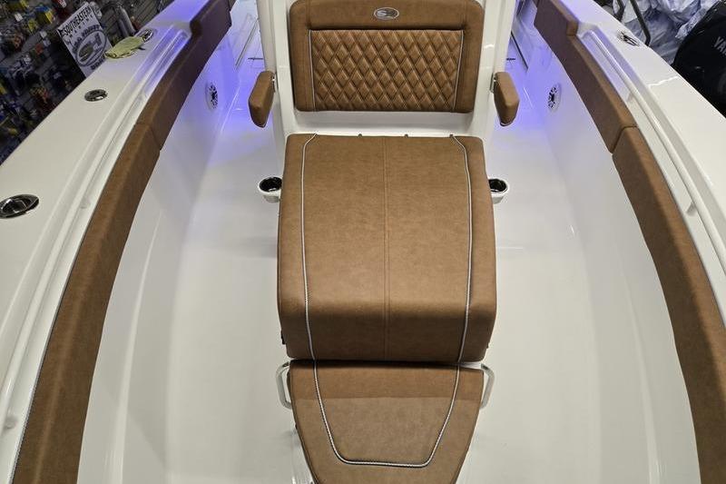 2026 Sea Hunt Ultra 275 Coffin Box interior with brown cushioned seating.
