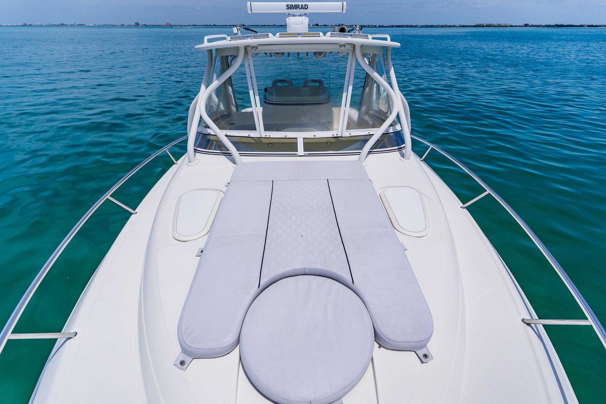 2008 Hydra-Sports Vector 3500 VX boat on calm blue water, featuring a spacious deck.