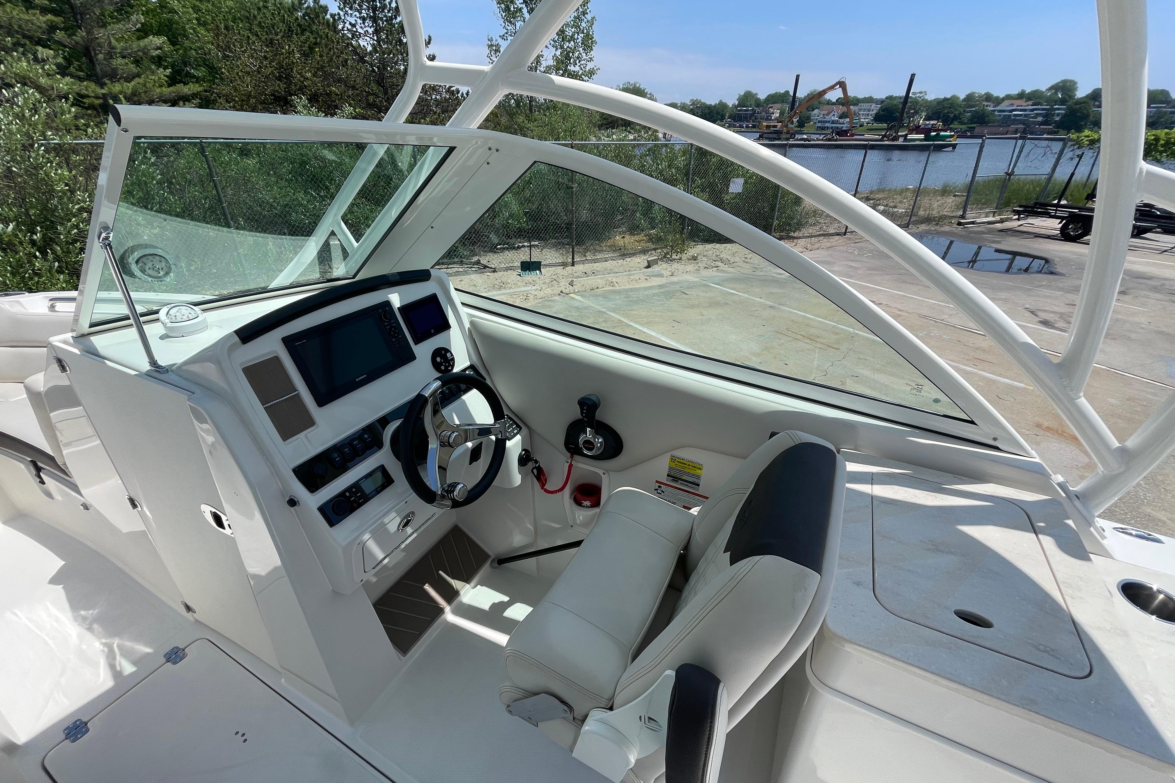 2022 Sailfish 245 DC boat cockpit with modern steering and navigation controls.