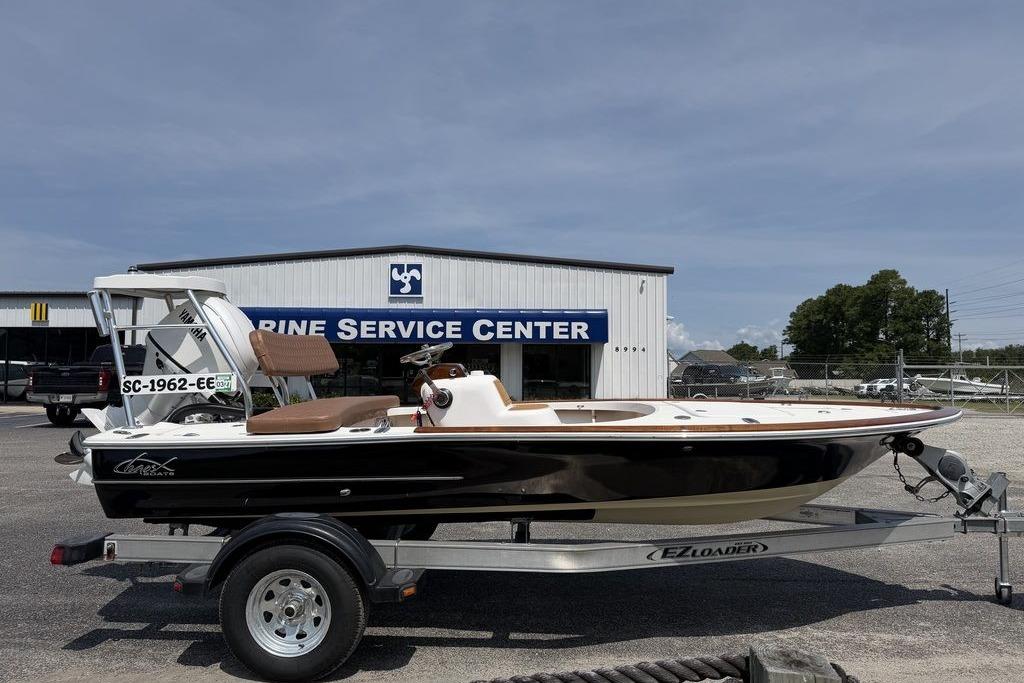 2012 Chaos 16 Bonefish boat on trailer at marine service center.