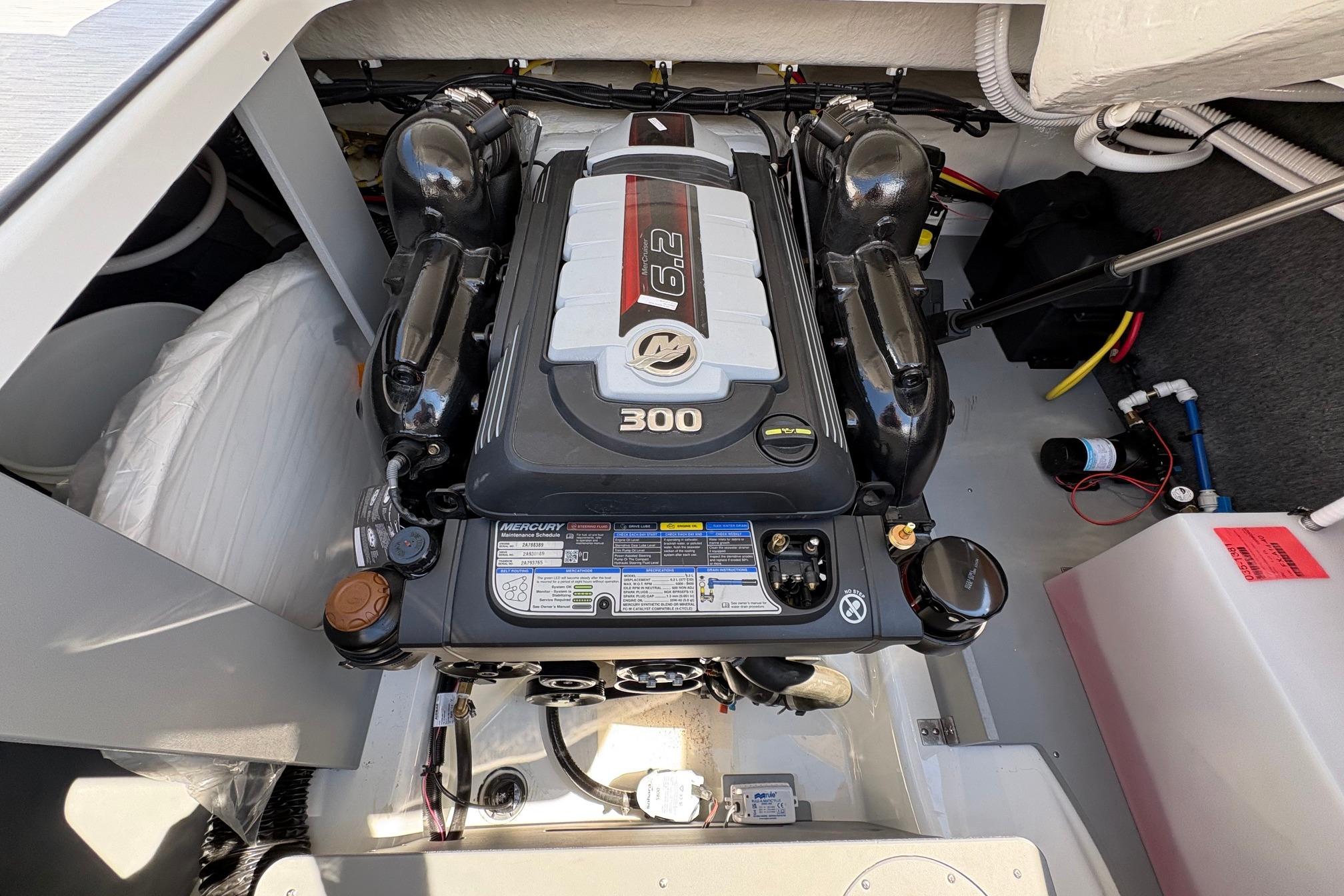 Engine compartment of 2026 Four Winns H6 boat, featuring a powerful Mercury 6.2L engine.