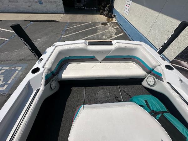 1992 Correct Craft Ski Nautique boat interior with white and teal seating.