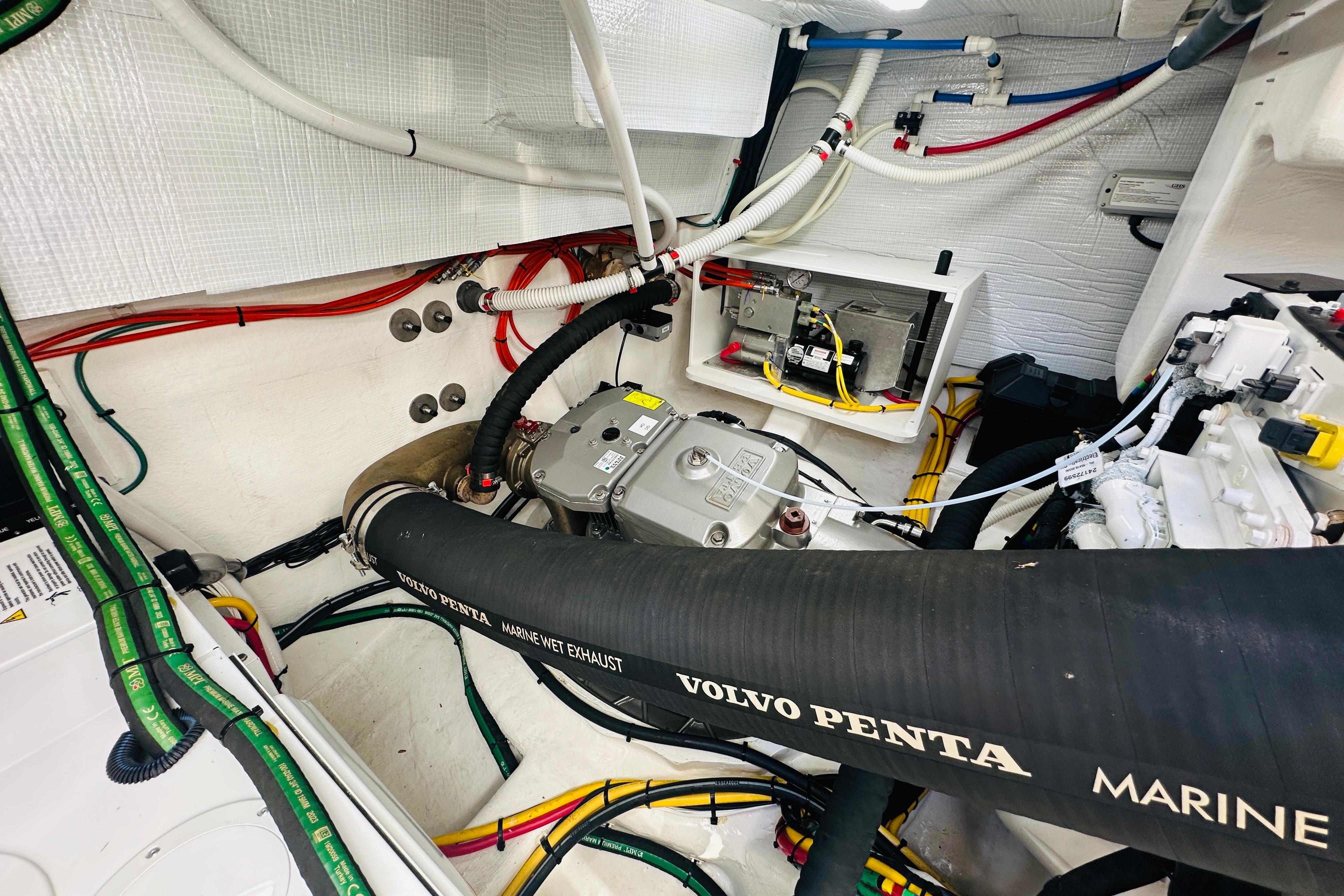 Engine room of 2025 Sabre 48 Salon Express with Volvo Penta marine exhaust system.