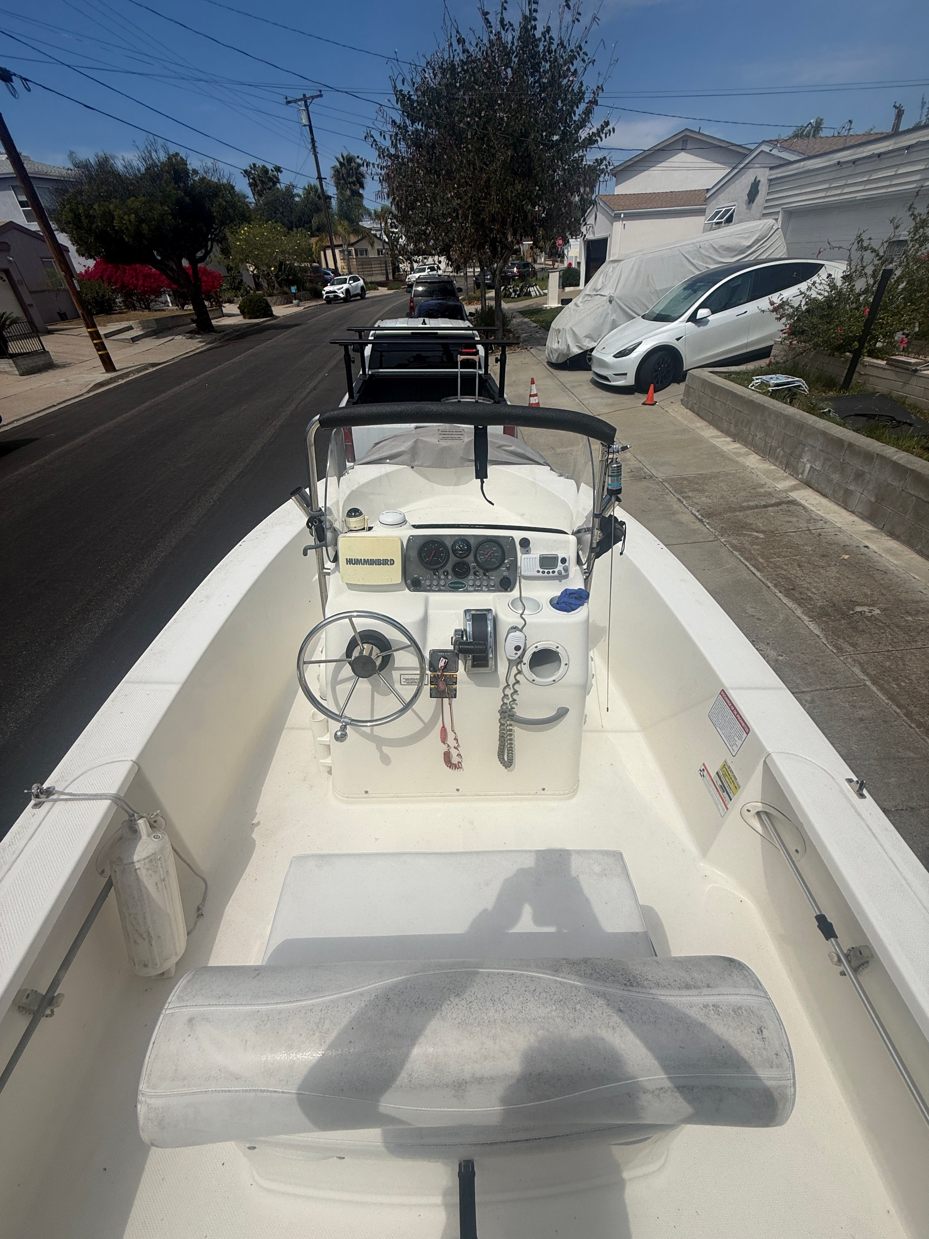 2008 Trophy 1703 Center Console boat parked on street.