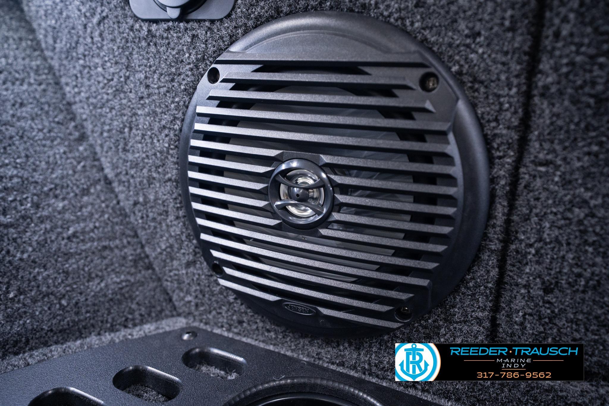 Speaker detail in 2026 Lund 1775 Impact XS SS boat interior, Reeder-Trausch Marine logo visible.