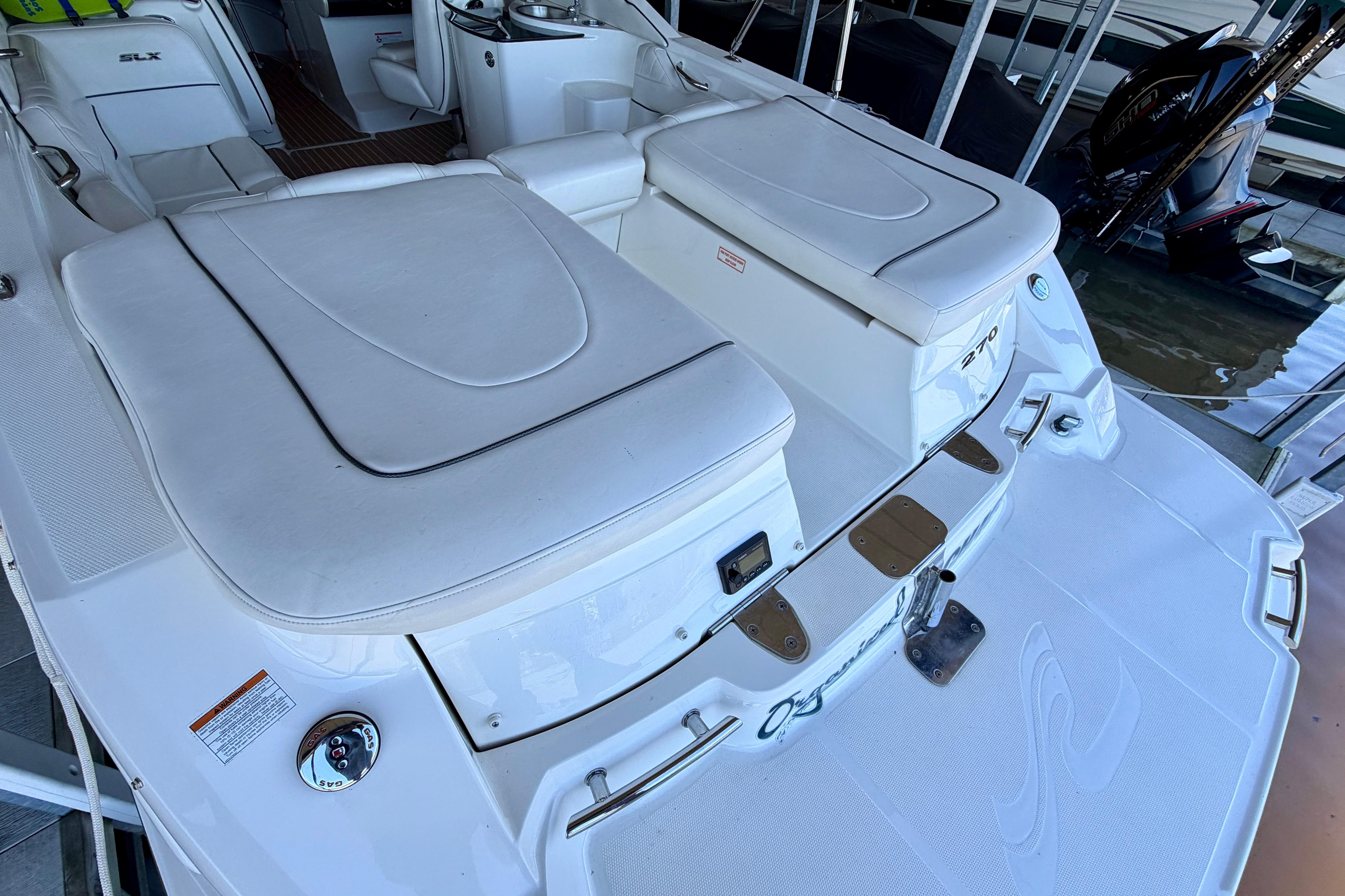 2007 Sea Ray 270 SLX boat interior with white seating and deck details.