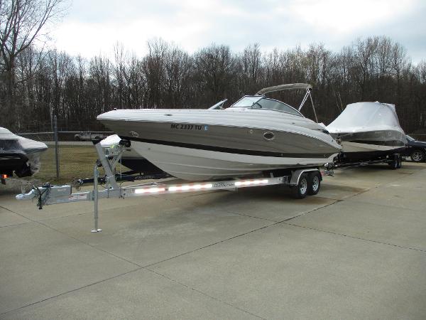 2015 Crownline 285 SS boat parked on trailer outdoors.