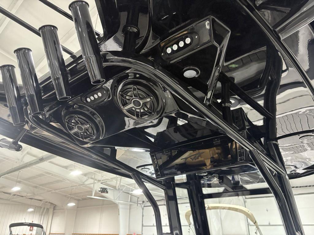 2026 Tidewater 2700 CB boat interior with black rod holders and speakers.