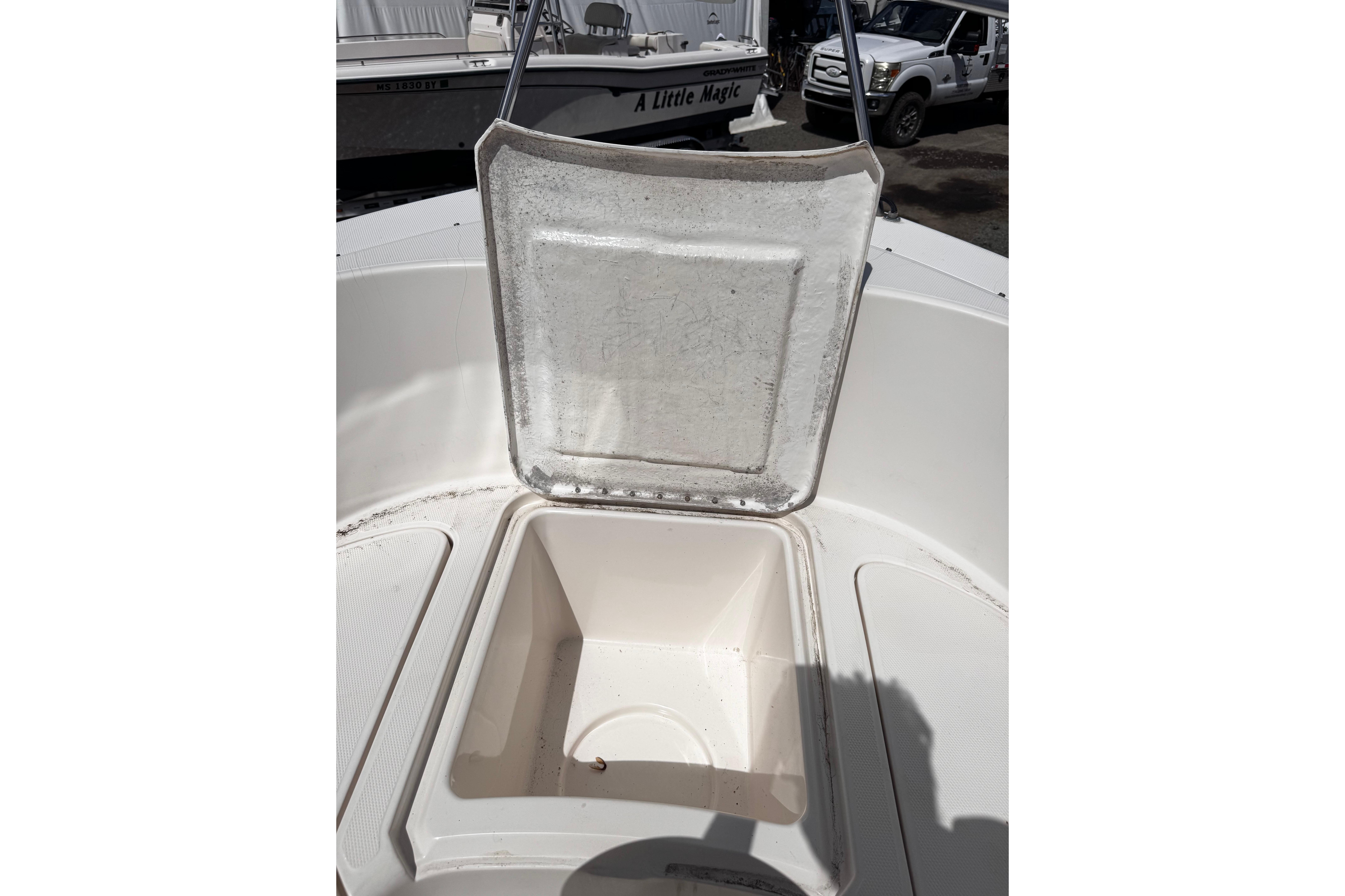 Open storage compartment on 2003 Palm Beach 2200 Dual Console boat.