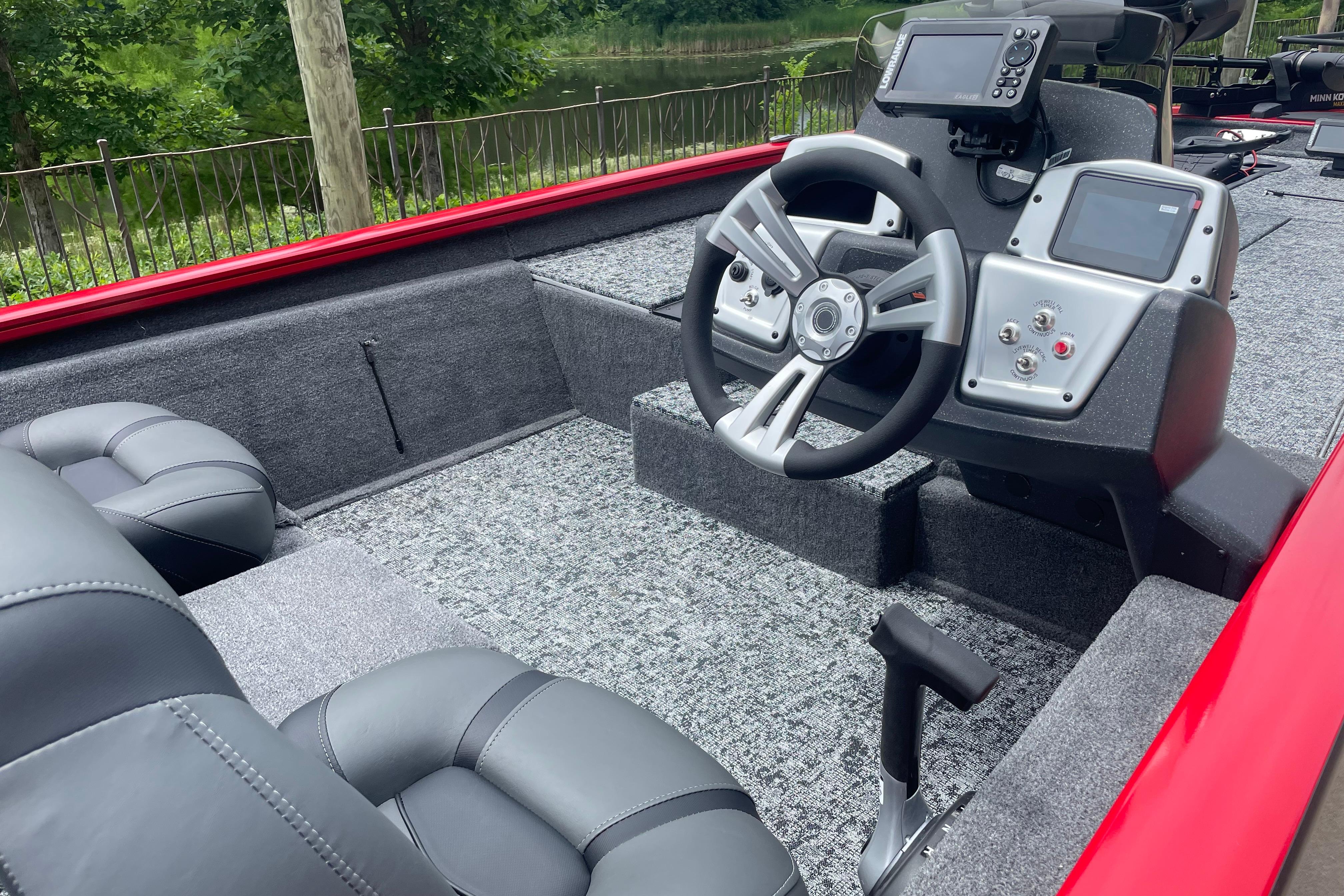 2026 Tracker Pro Team 190 boat interior with steering wheel and control panel.