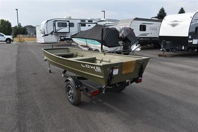 2025 Lowe L1240 Jon boat on trailer, parked near RVs in a lot.