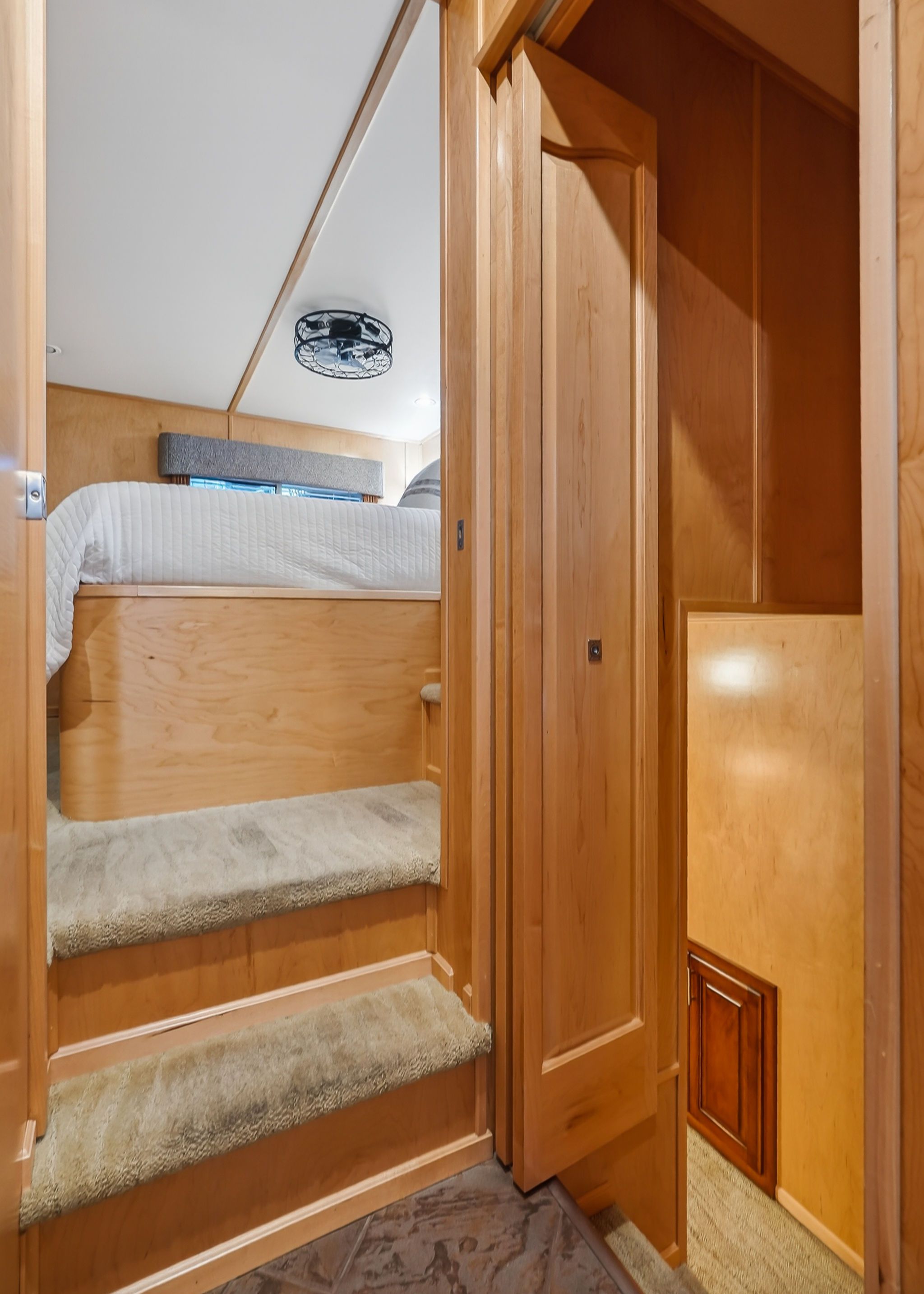 Interior of 2010 Houseboat Throughbred with stairs and bedroom.