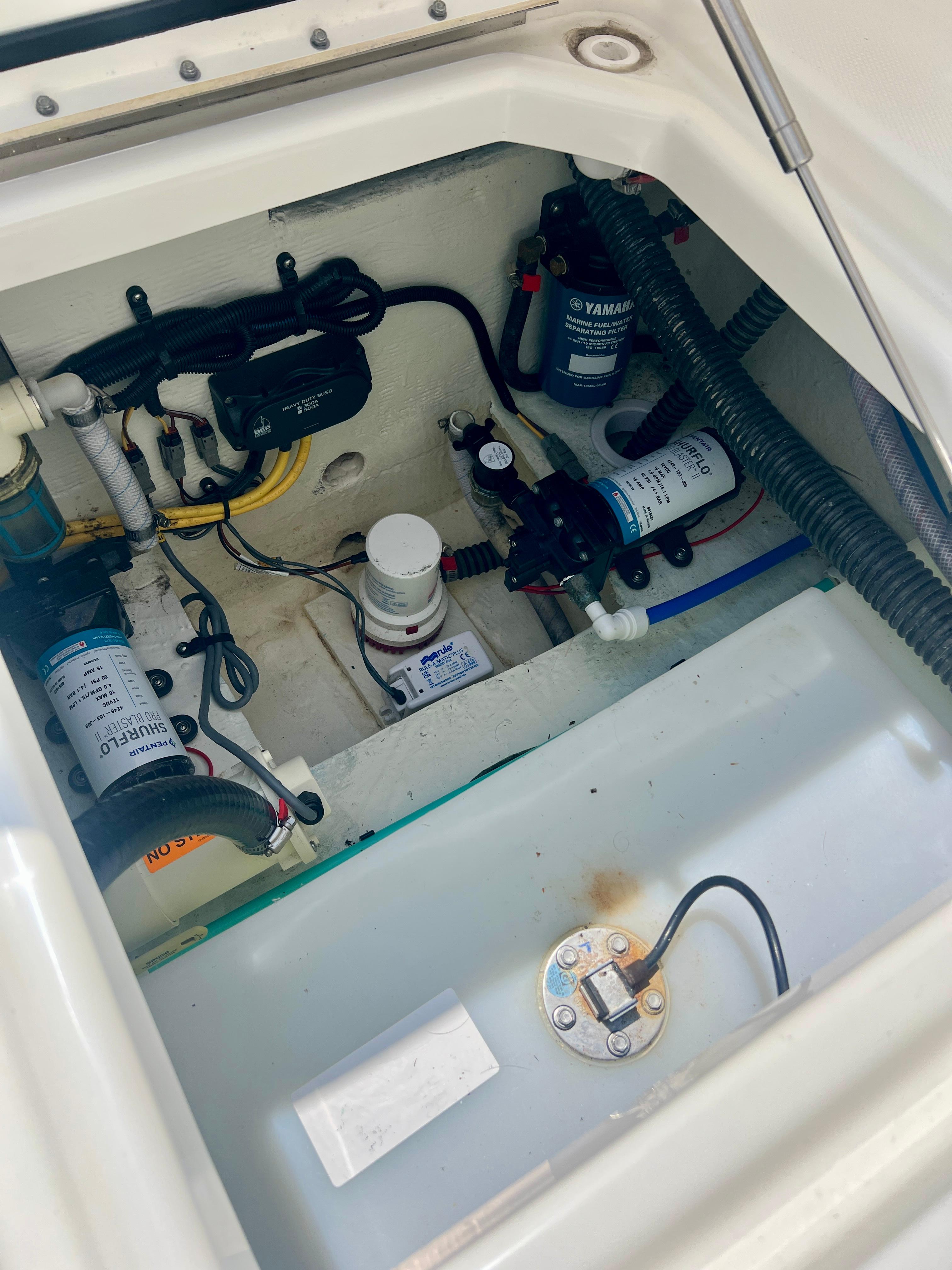 2024 World Cat 280DC-x boat engine compartment with wiring and components.