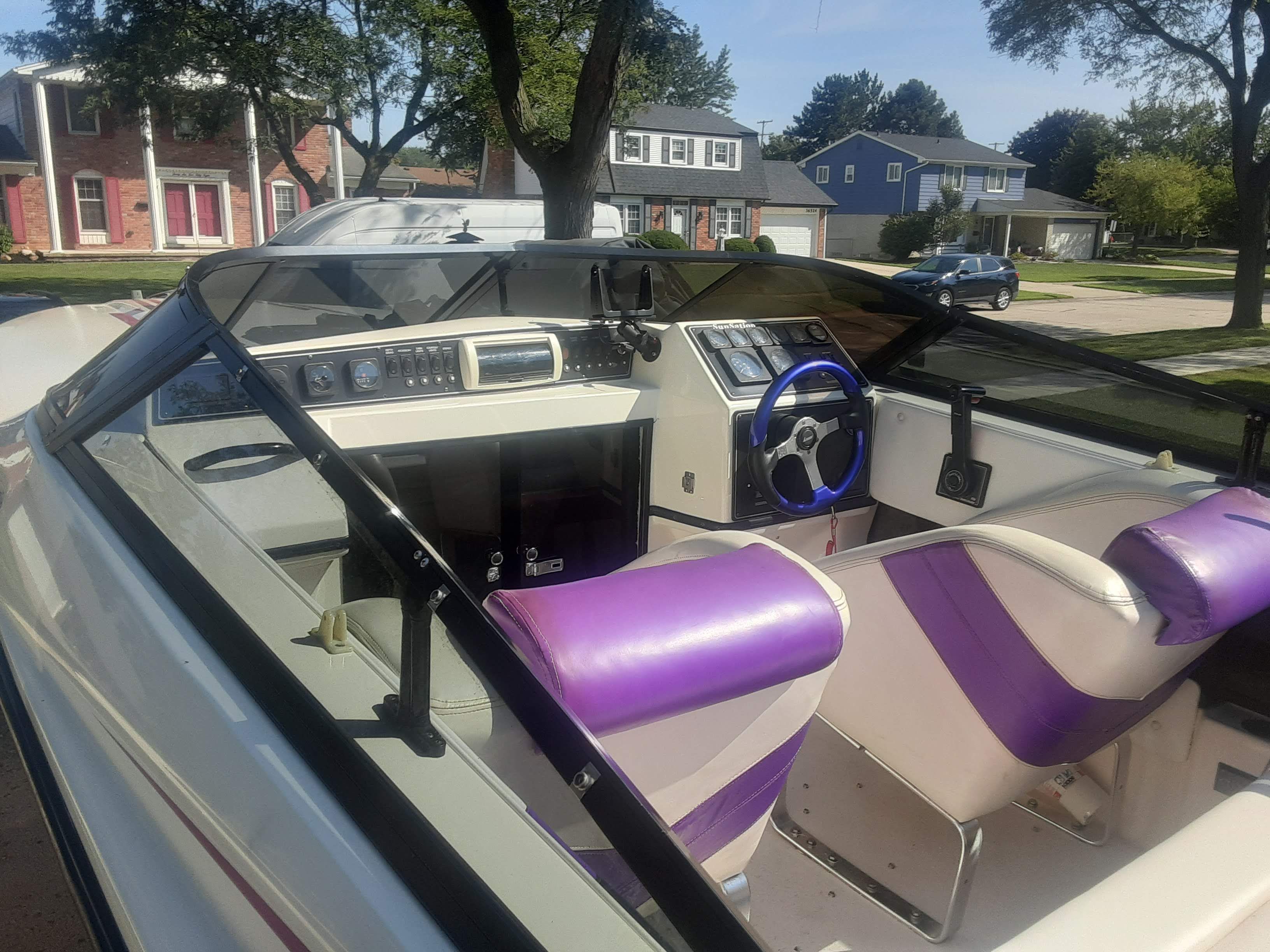 Interior of a 1993 Sunsation Aggressor boat with purple seats.